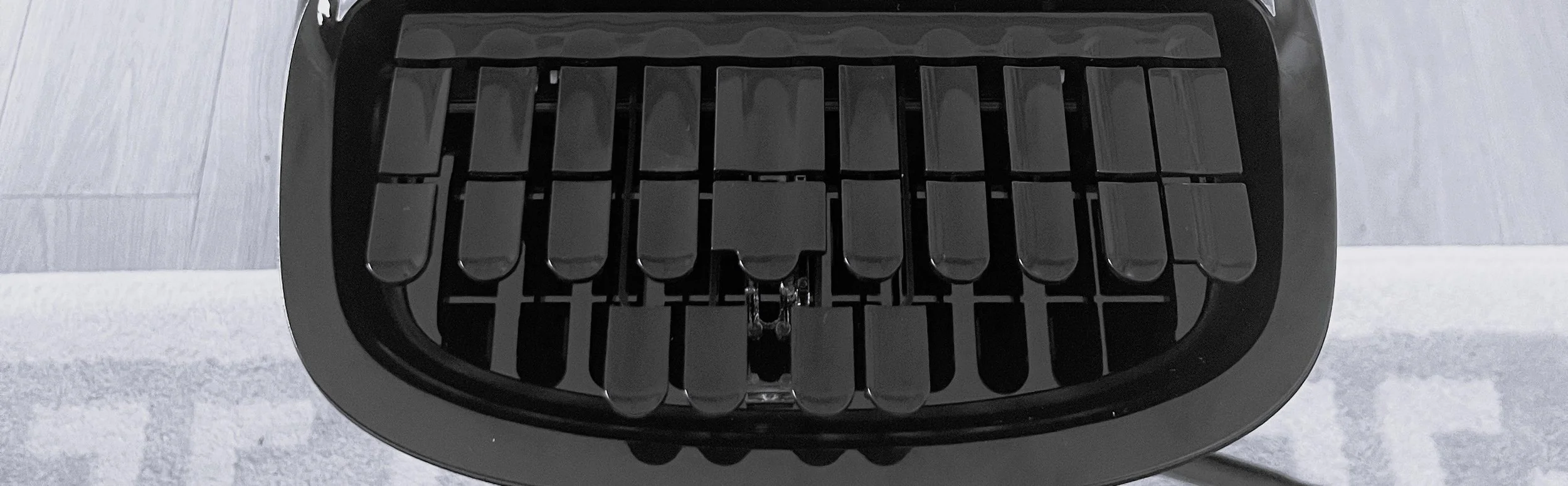 Black stenography keys, with rug on floor.