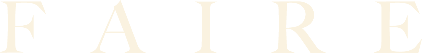 Close-up of text spelling the word "FAIRE" with a black background.