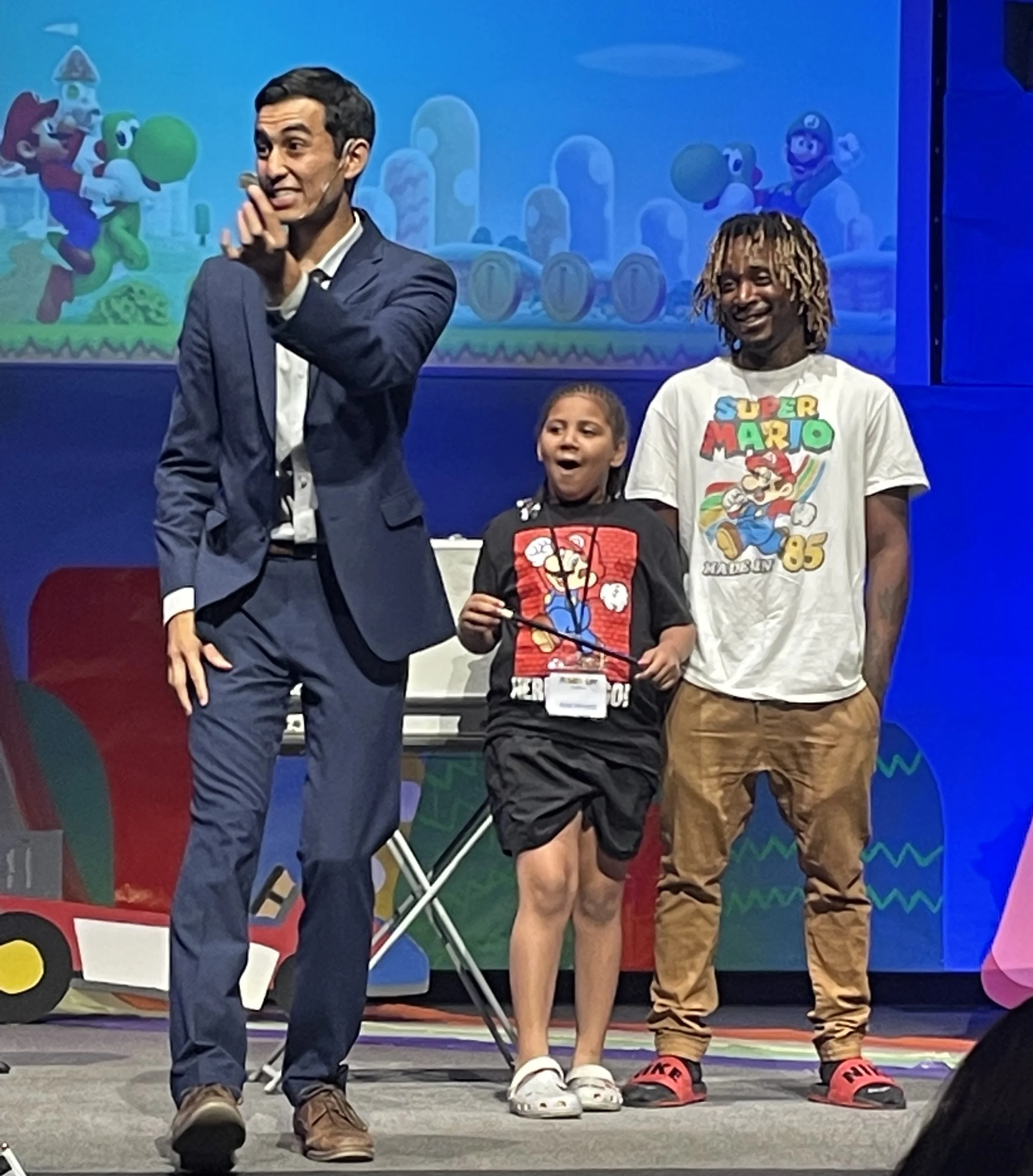 Brady entertaining father and daughter on stage.