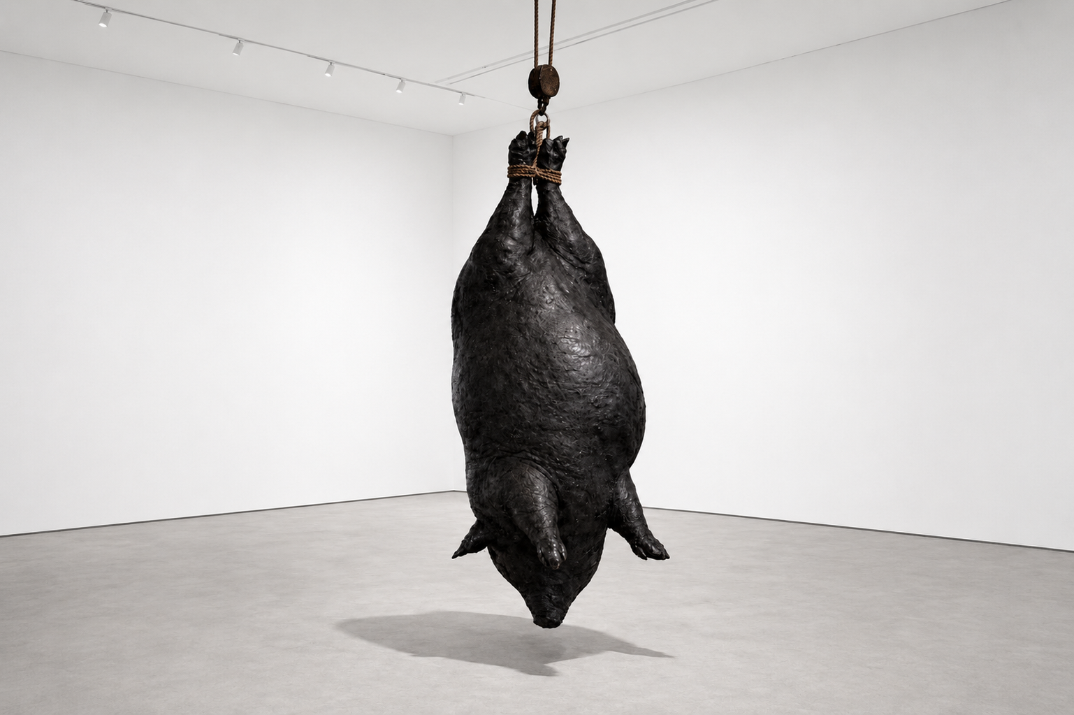 Dead Weight, 2025, Hand-pounded lead over form, rope, steel pulley, suspended hardware Approx. 8 ft. high × 4 ft. wide × 4 ft. deep