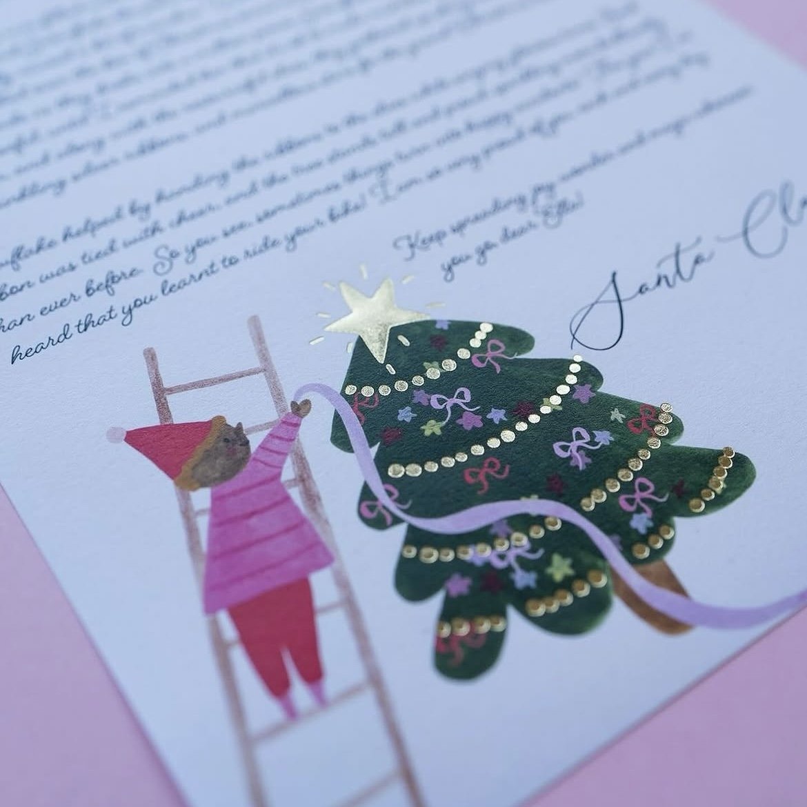Illustration of a teddy bear decorating a Christmas tree with ornaments and ribbons, with a star on top, on a festive card.