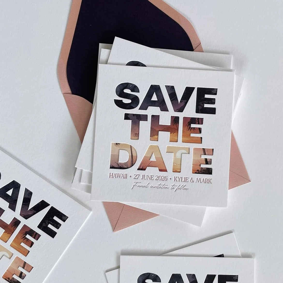 A save-the-date card with a sunset and palm trees background for Hawaii, dated June 27, 2026, for Kylie and Mark, with an envelope underneath.