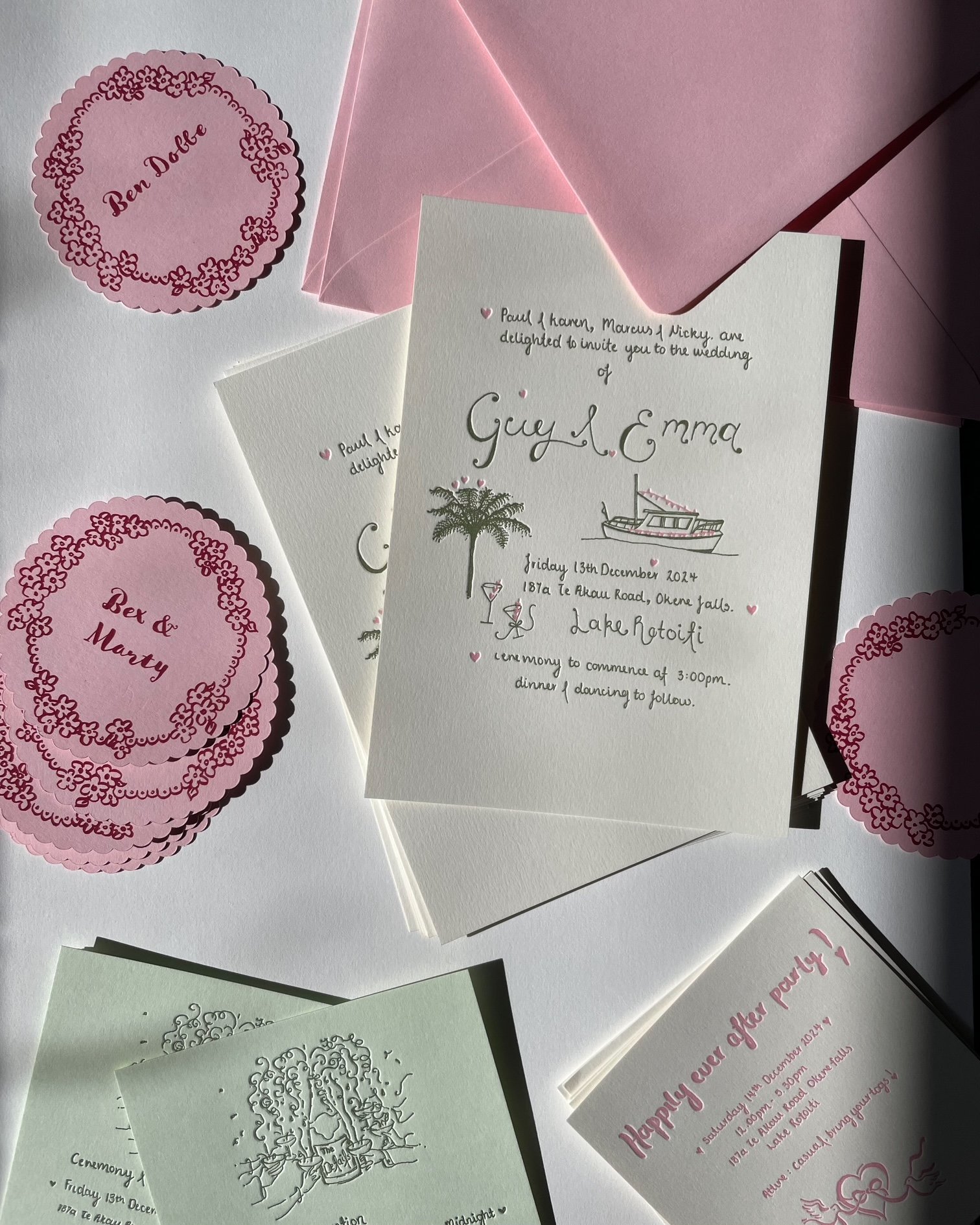 Invitation cards and wedding stationery featuring pink and white colors, floral designs, a boat illustration, and elegant cursive text for a wedding event.