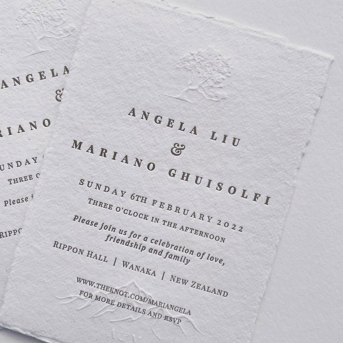 Wedding invitation printed on textured white paper with embossed tree design, details for Angela Liu and Mariano Ghiusoli's wedding on February 6, 2022, at Rippon Hall, Wanaka, New Zealand.