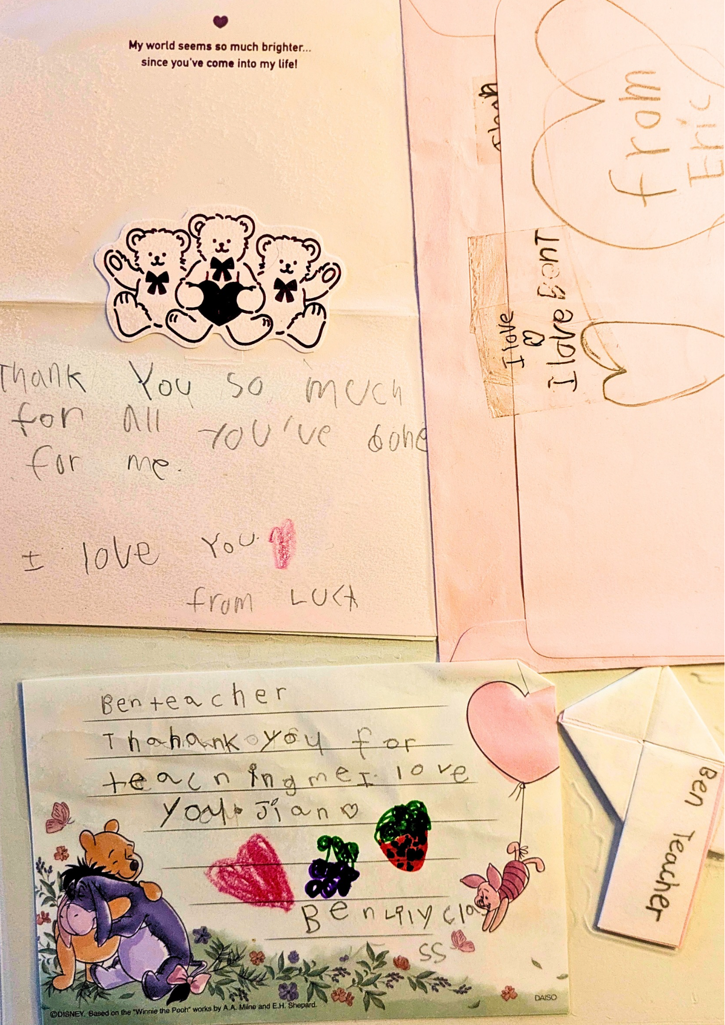 Children's handwritten thank you notes with colorful drawings, stickers, and cutouts of bears and cartoon characters, expressing gratitude to teachers and caregivers.