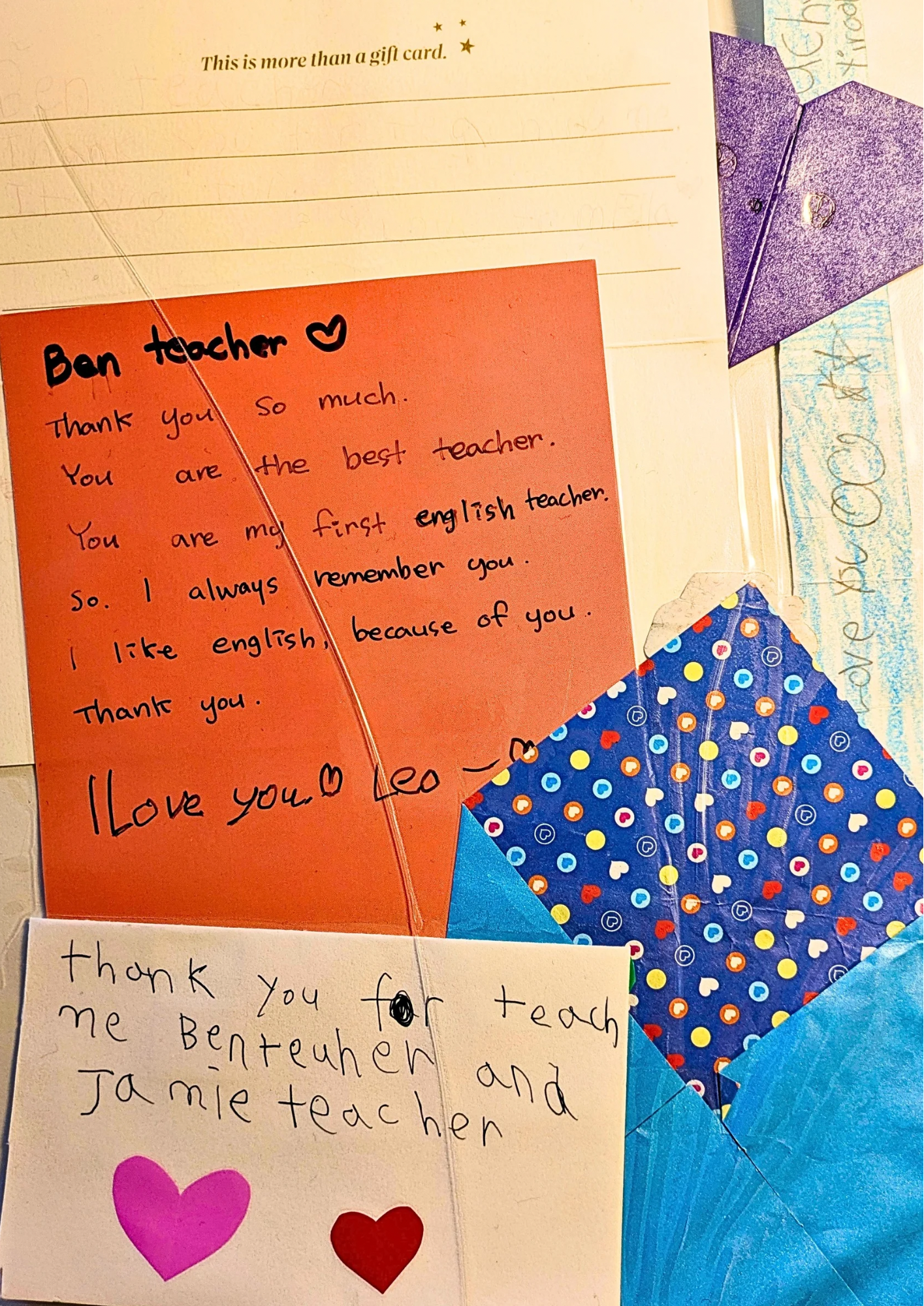 Collection of handwritten thank you notes and greeting cards for teachers, decorated with hearts and colorful paper envelopes.