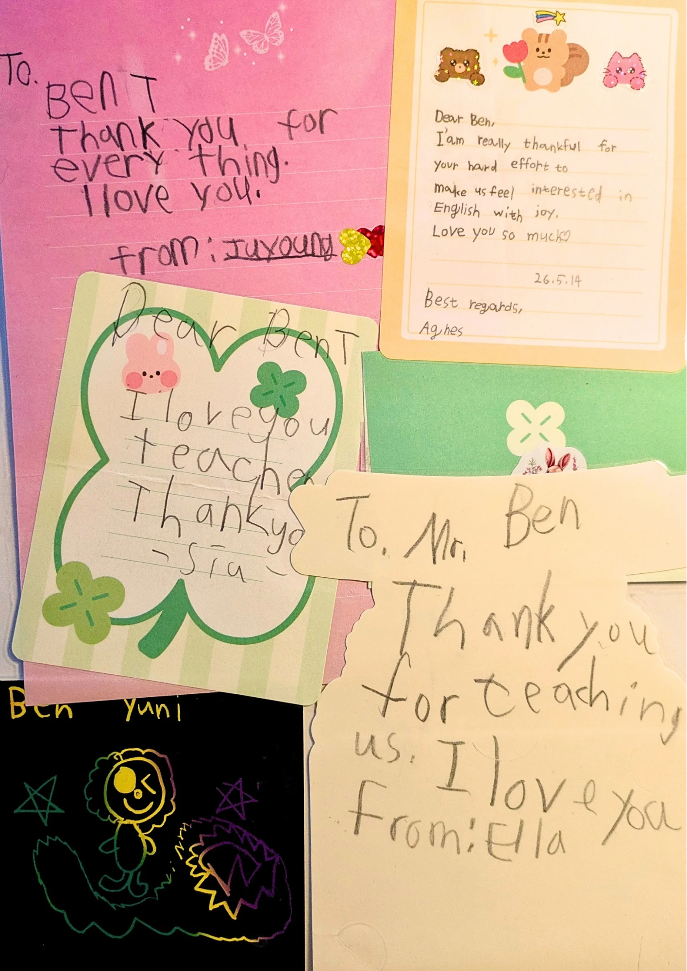 Collection of handwritten notes and cards of gratitude and love, some decorated with stickers and drawings of hearts, butterflies, and stars, including a note with a pig drawing and shamrocks.