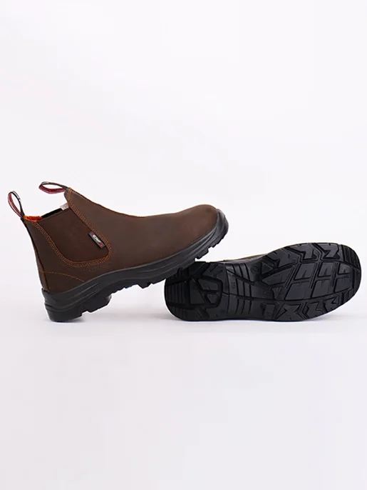 Pair of brown waterproof safety boots with black soles, one boot lying flat and the other upright.