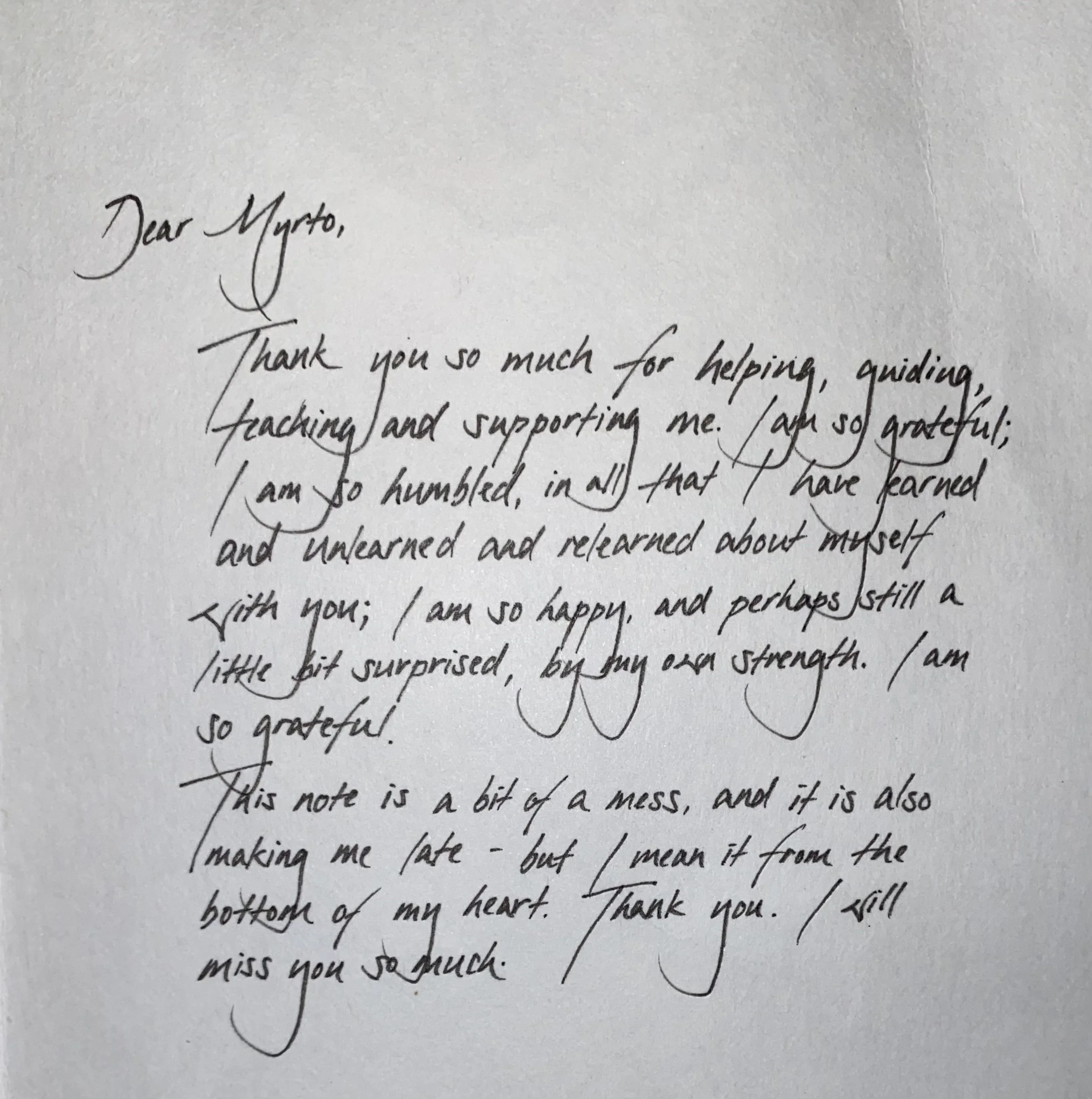Close-up of a handwritten note in cursive, expressing gratitude and emotional reflection.