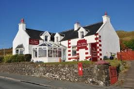 The Tables - built in 1896 and is a traditional one and a half height building positioned slightly elevated from the road, with wonderful views across Loch Dunvegan to MacLeod's Tables Mountains.