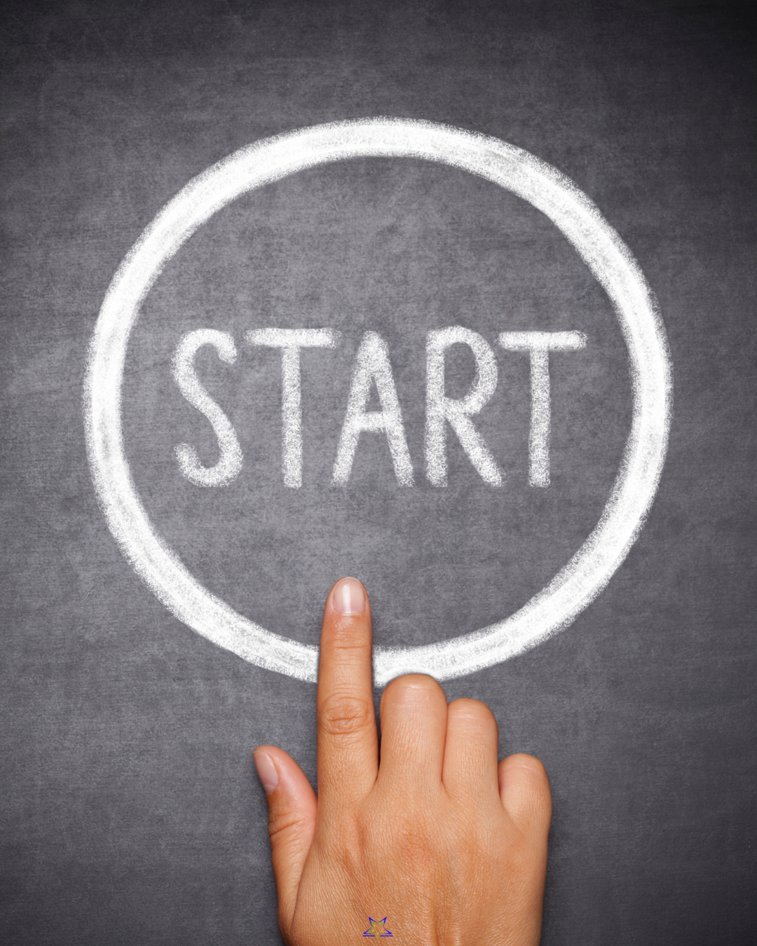 The image shows a hand pressing on  a chalk circle marked start, drawn on a grey chalkboard