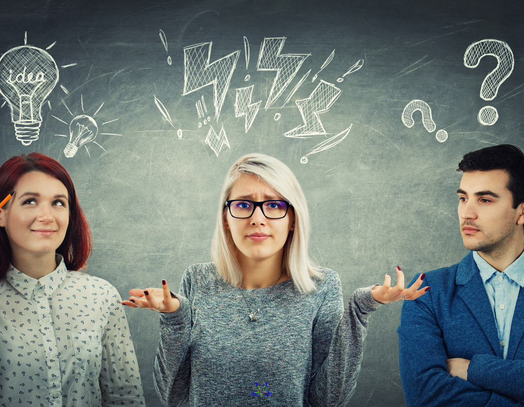 Image shows two women and a man in a row against a chalkboard background. Above their heads are chalk question marks, lightening bolts and lightbulbs and the woman in the middle is holding up her hands in confusion