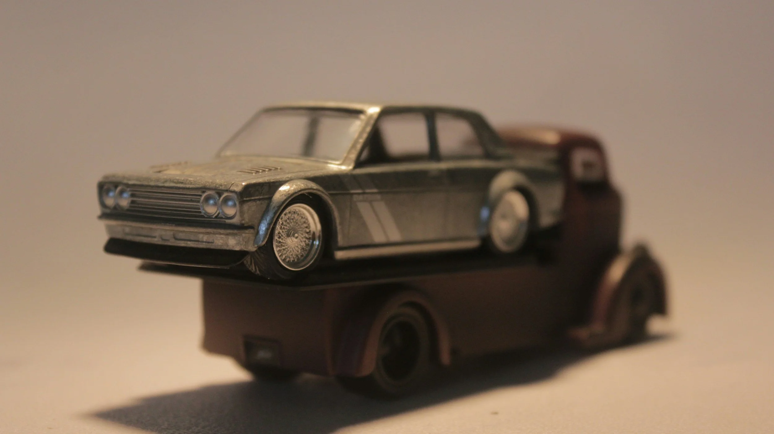 toy car on flatbed truck representing transportation safety and crash recovery