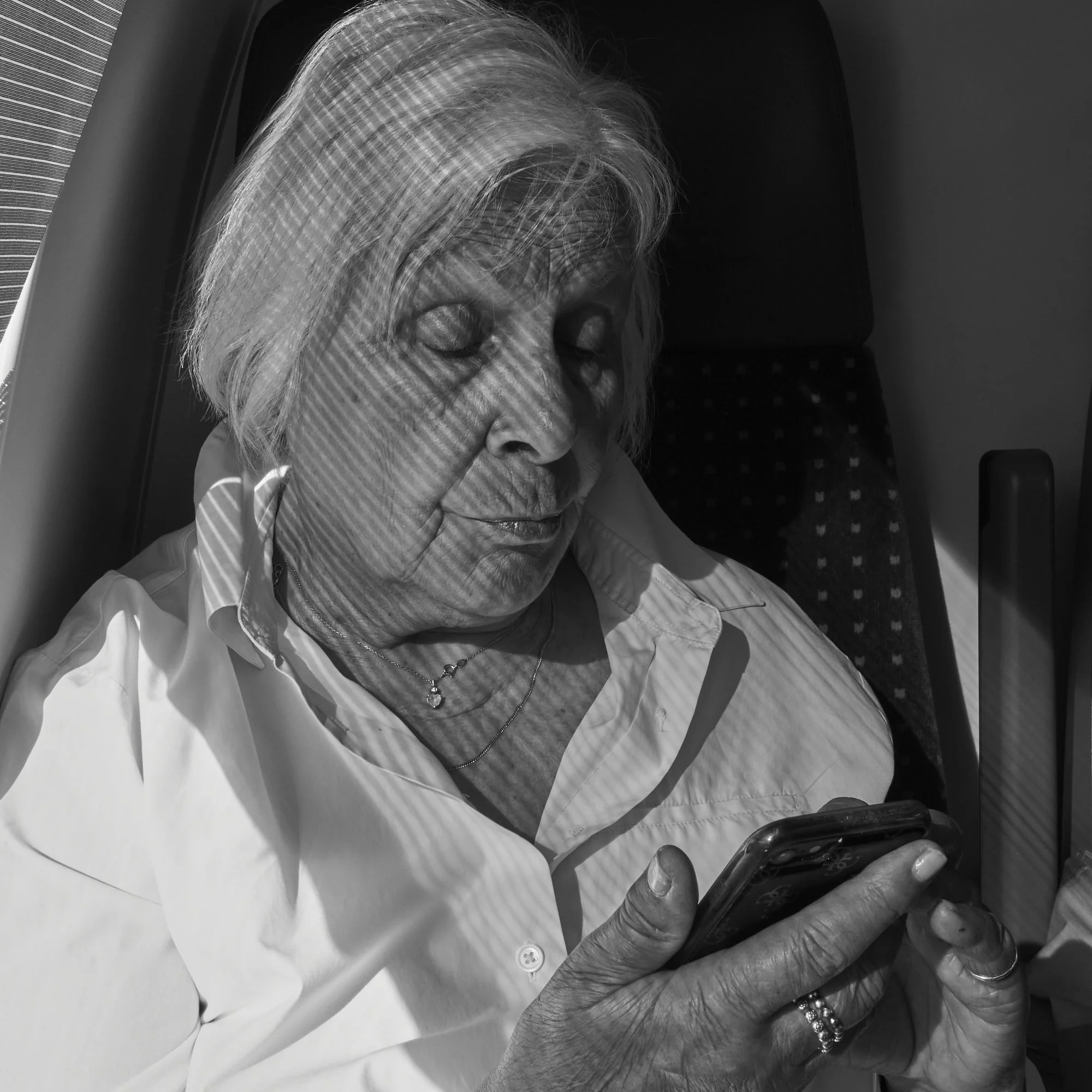 my wife... in the shaded sunshine... on the train from Lausanne