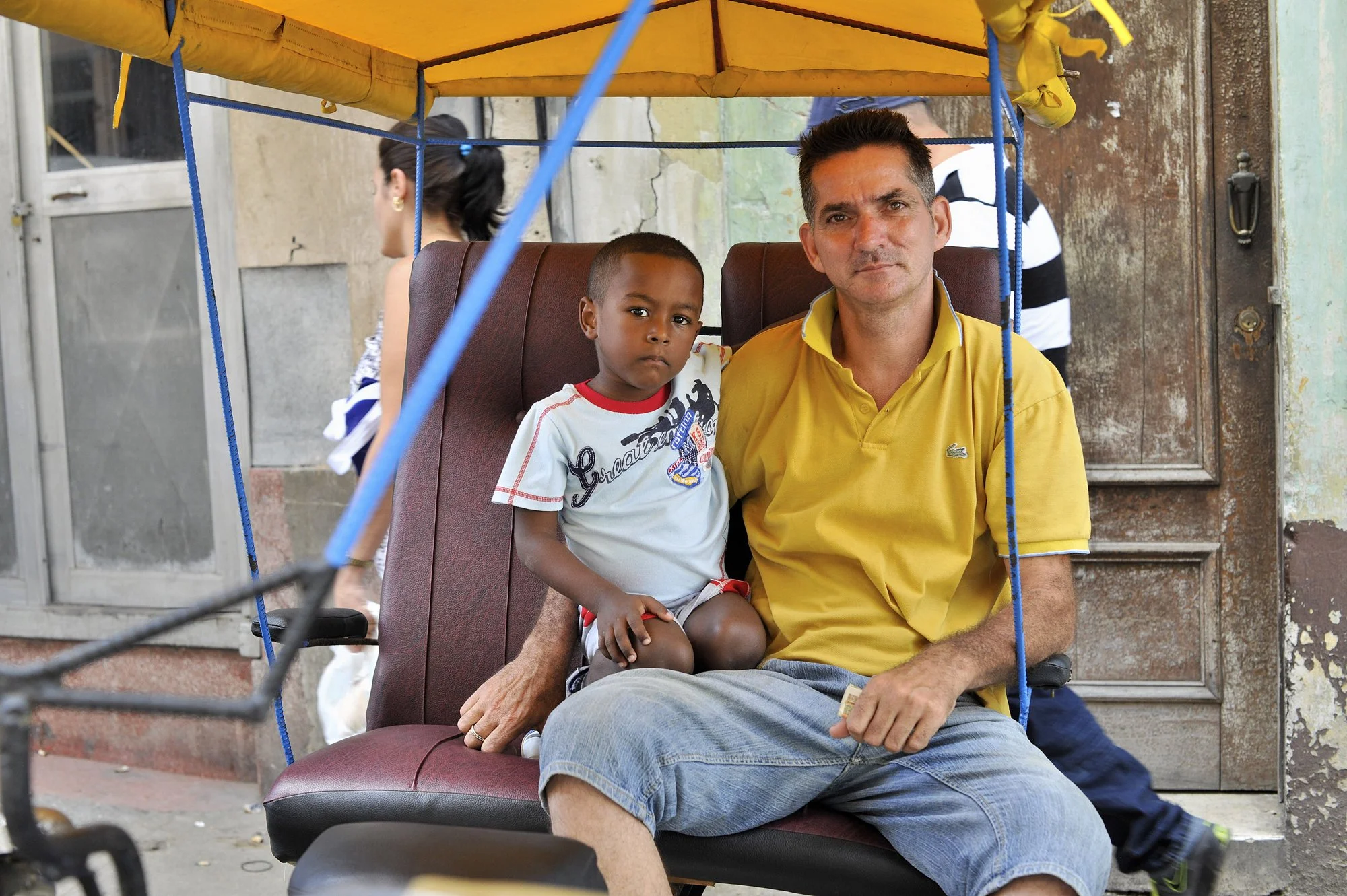 Rickshaw Driver With Son