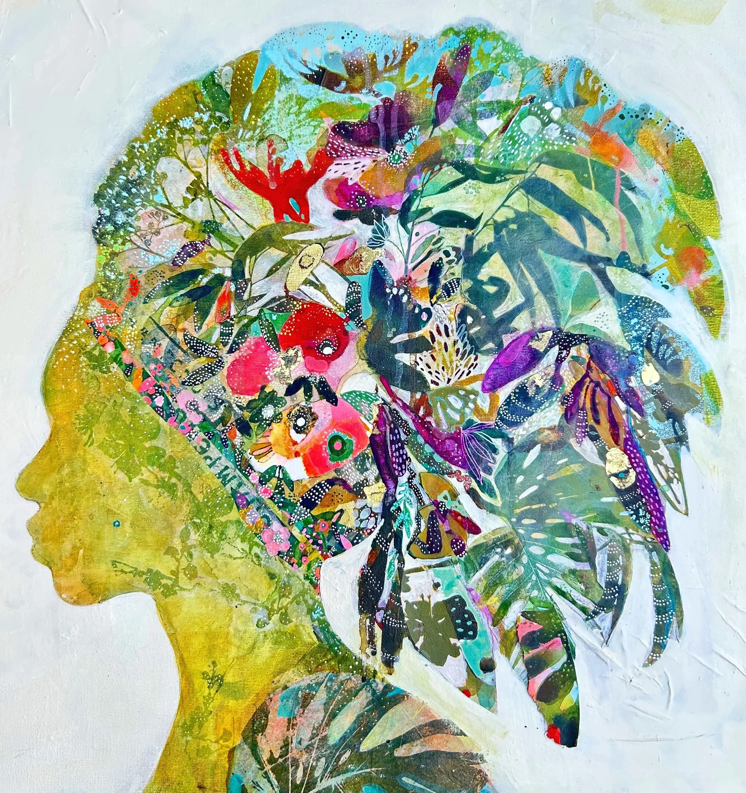 Side profile of a woman crowned in abundant florals and mixed-media collage pieces.