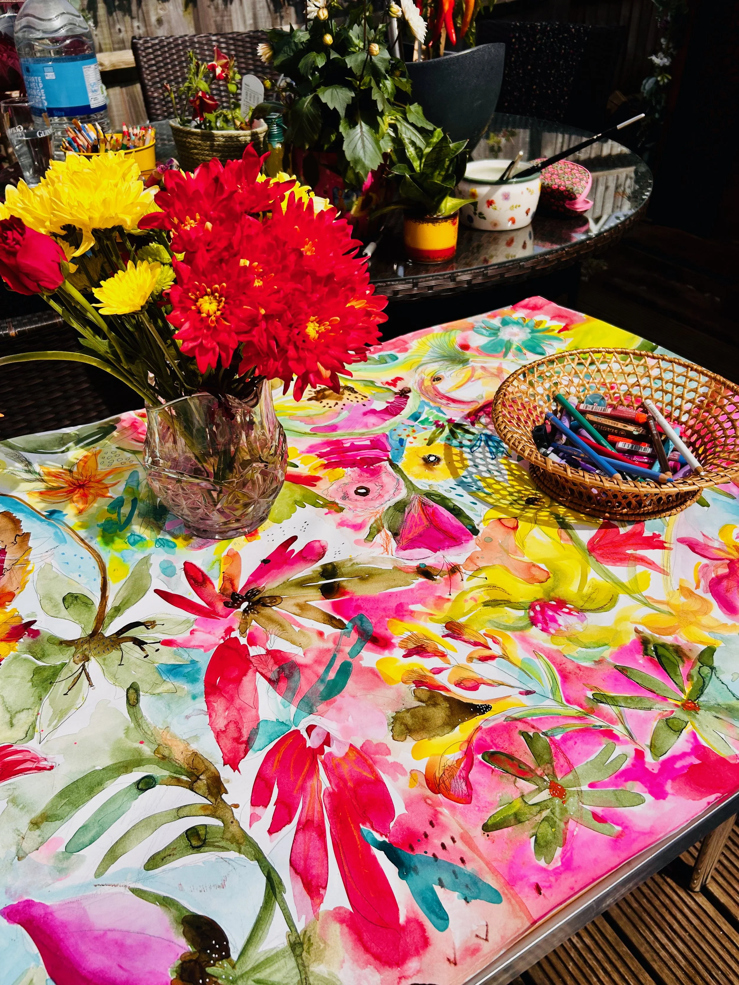 Finished floral table artwork, filled with participants communal painting created during Pause & Bloom workshop.