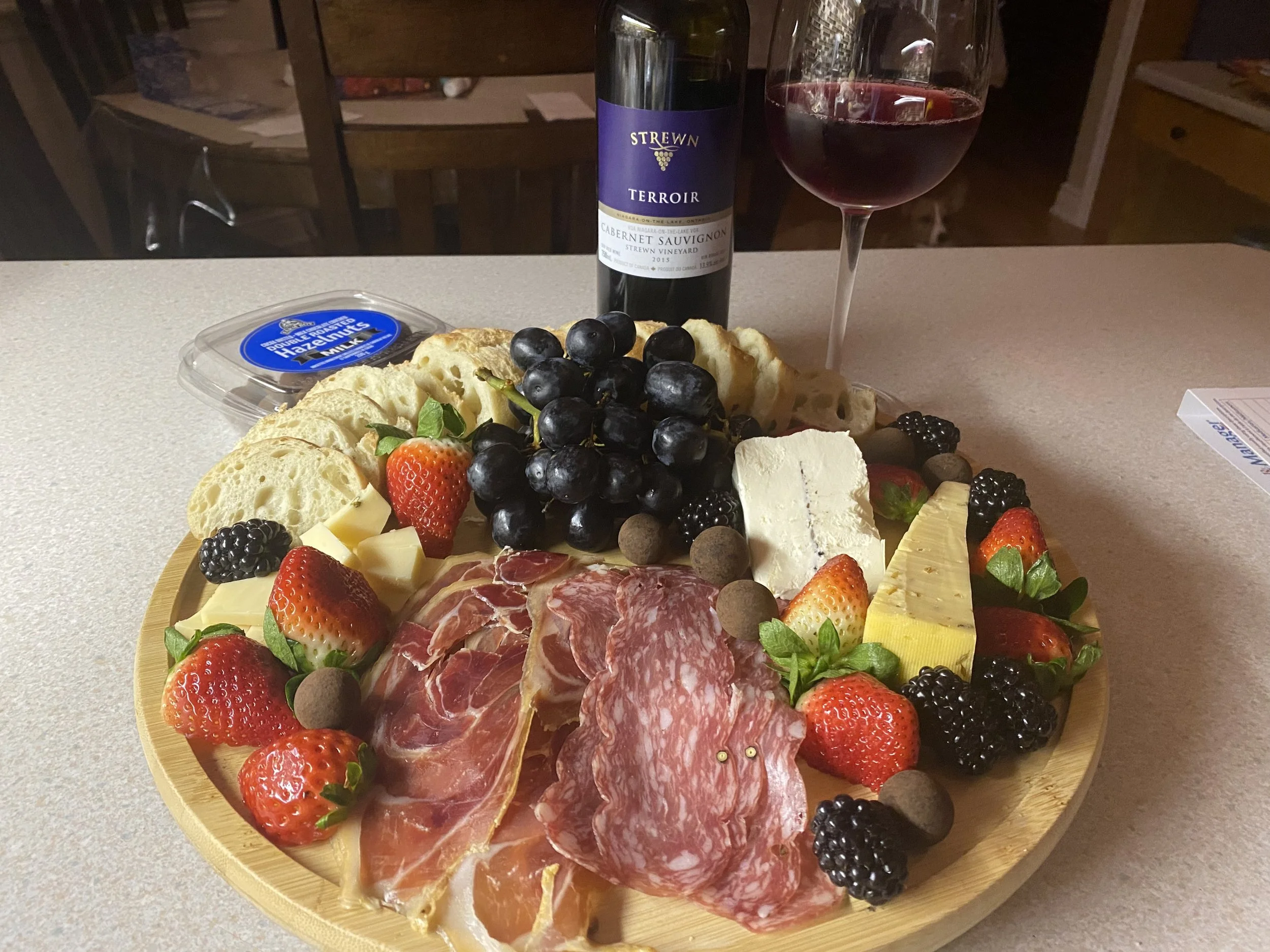 Charcuterie board with wine