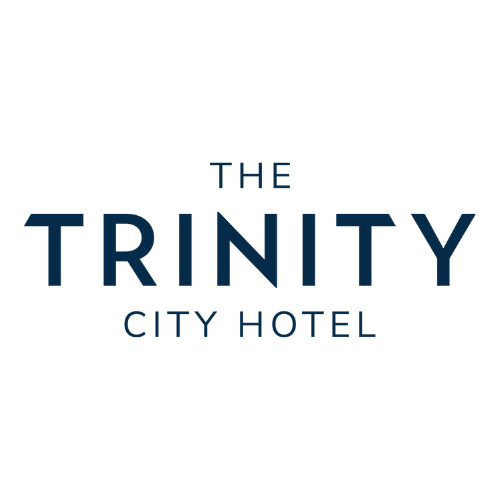 Logo for The Trinity City Hotel featuring the hotel name in dark blue text on a white background.