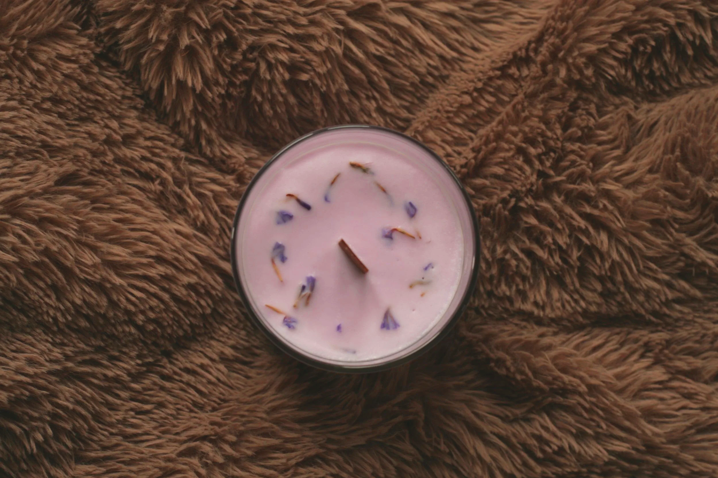 Lavender-scented soy candle in clear glass jar by Mara Candles