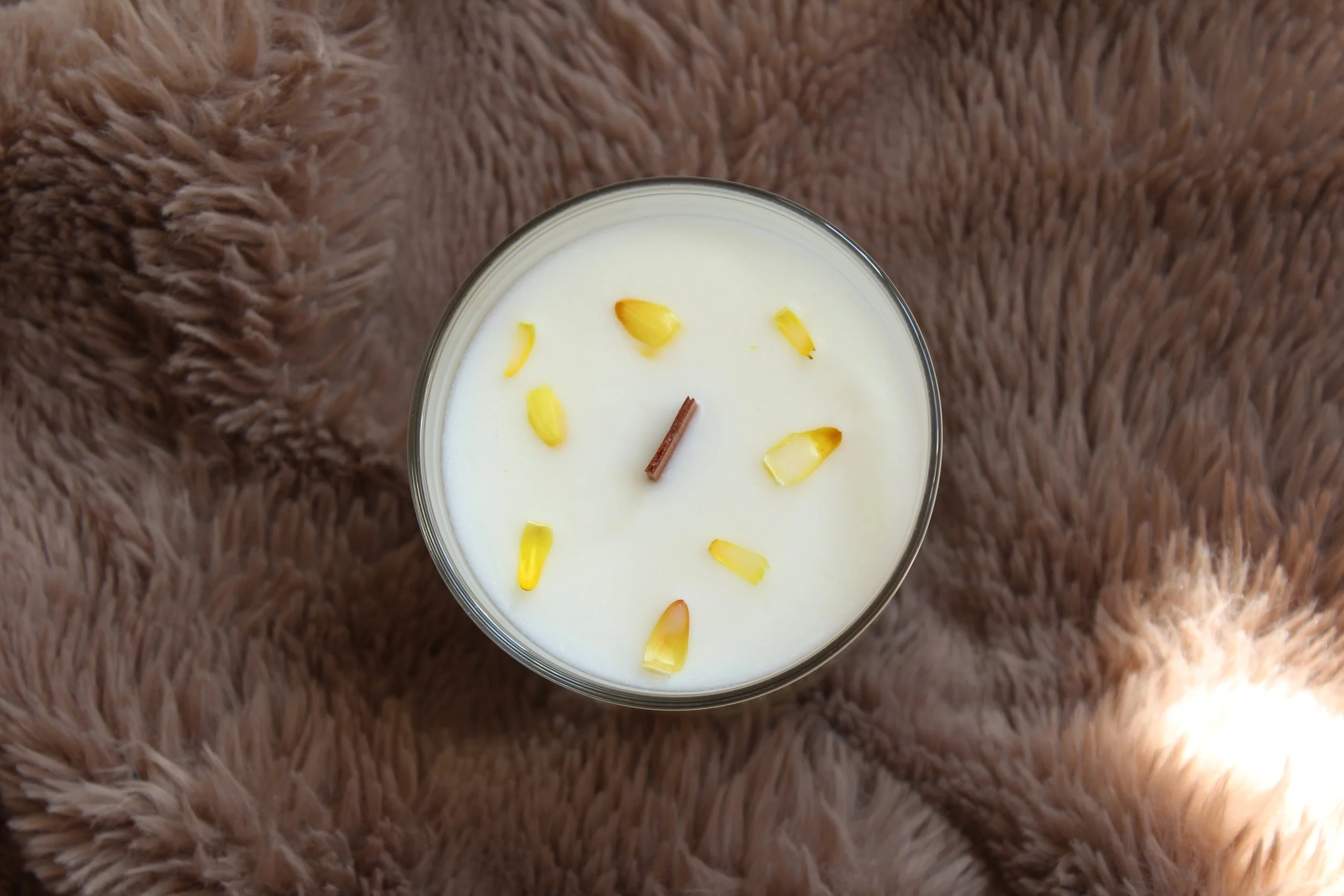 Pear and freesia scented soy candle in glass jar with wooden wick, decorated with dried flowers, by Mara Candles