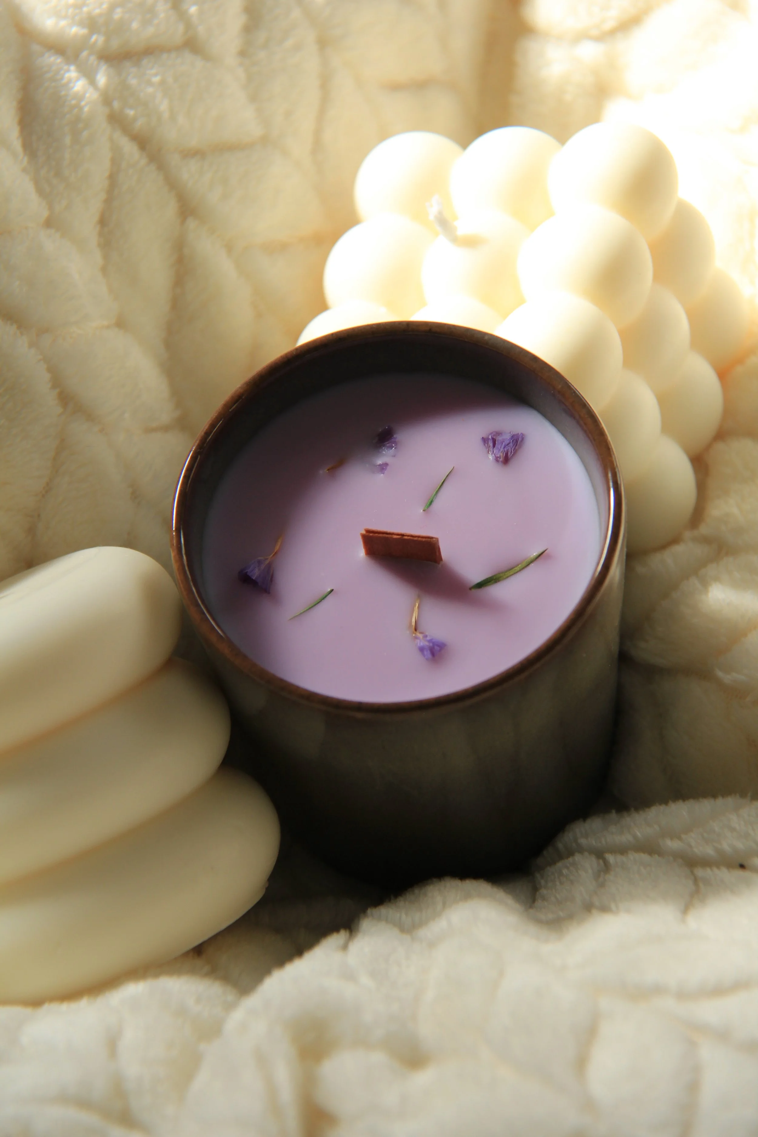 Luna Nights scented soy candle in ceramic jar with dried lavender