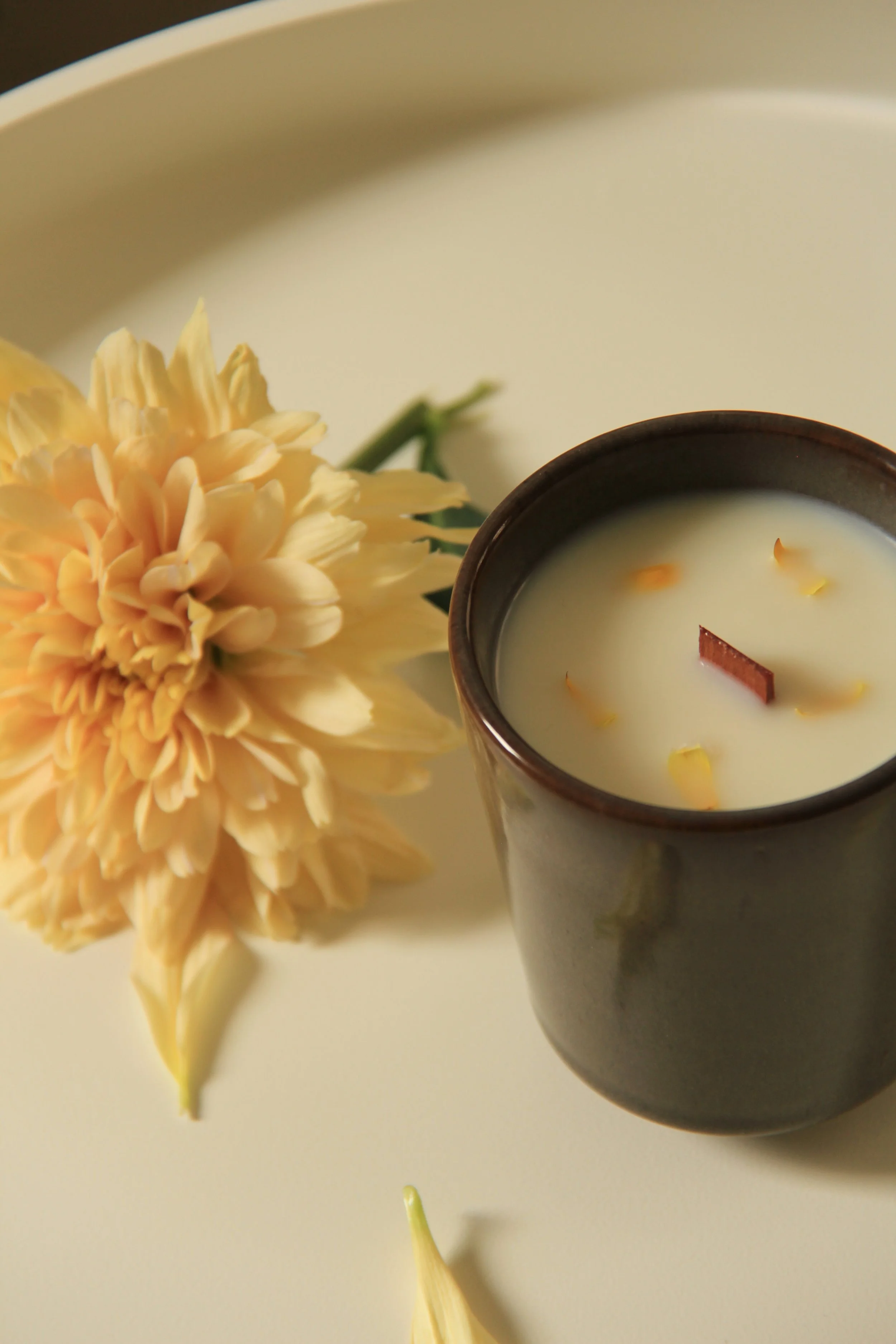 Pear and freesia scented soy candle in glass jar with wooden wick, decorated with dried flowers, by Mara Candles