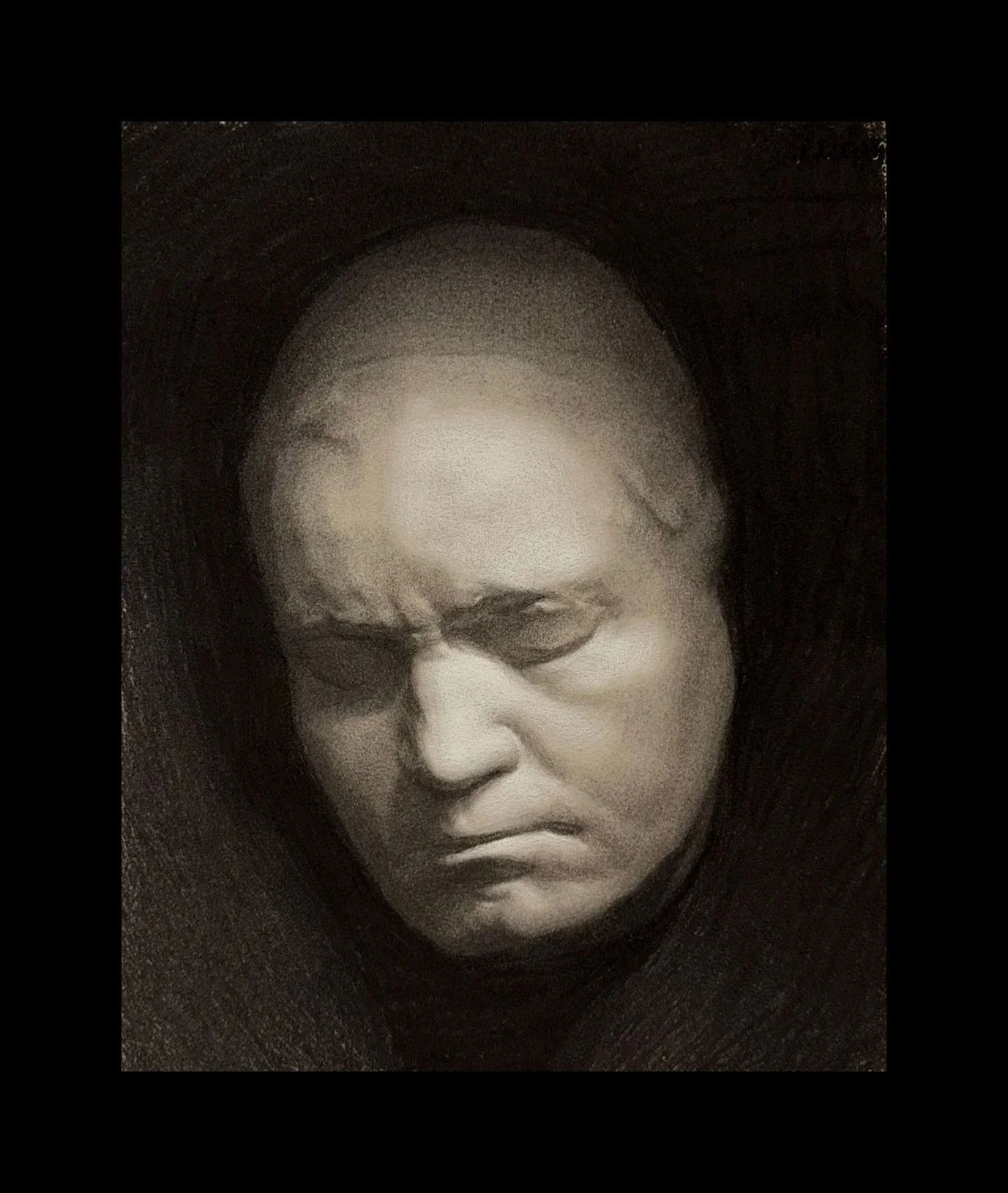 A black and white portrait of Beethoven with an angry or frustrated expression, with furrowed brows and lips pressed together.