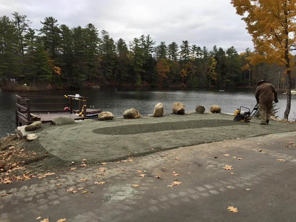 Final compaction of a waterfront parking area.