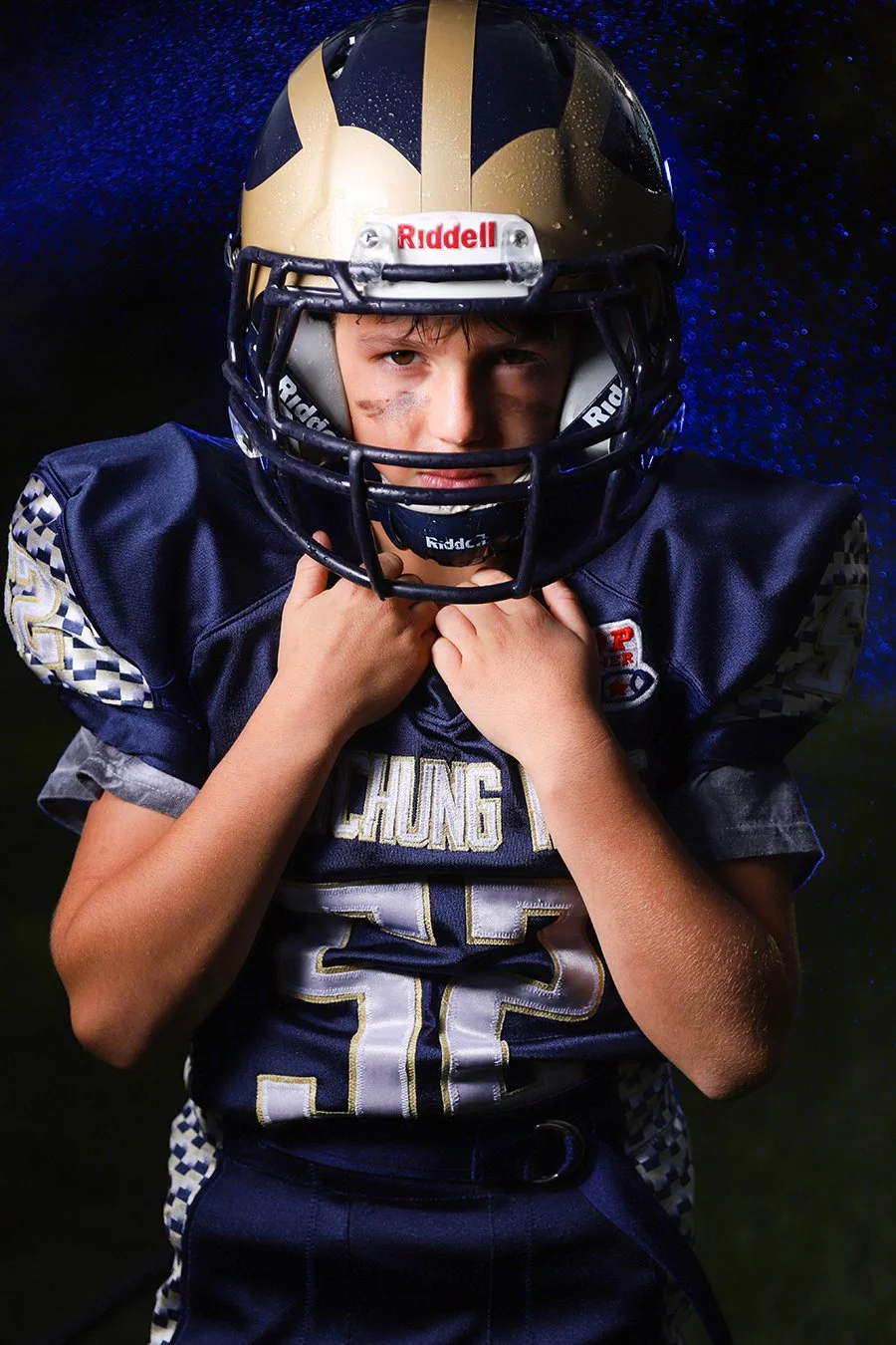 youth football player blue sports portrait.jpg
