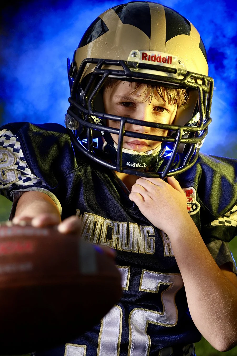 sports portrait boy holding football.jpg