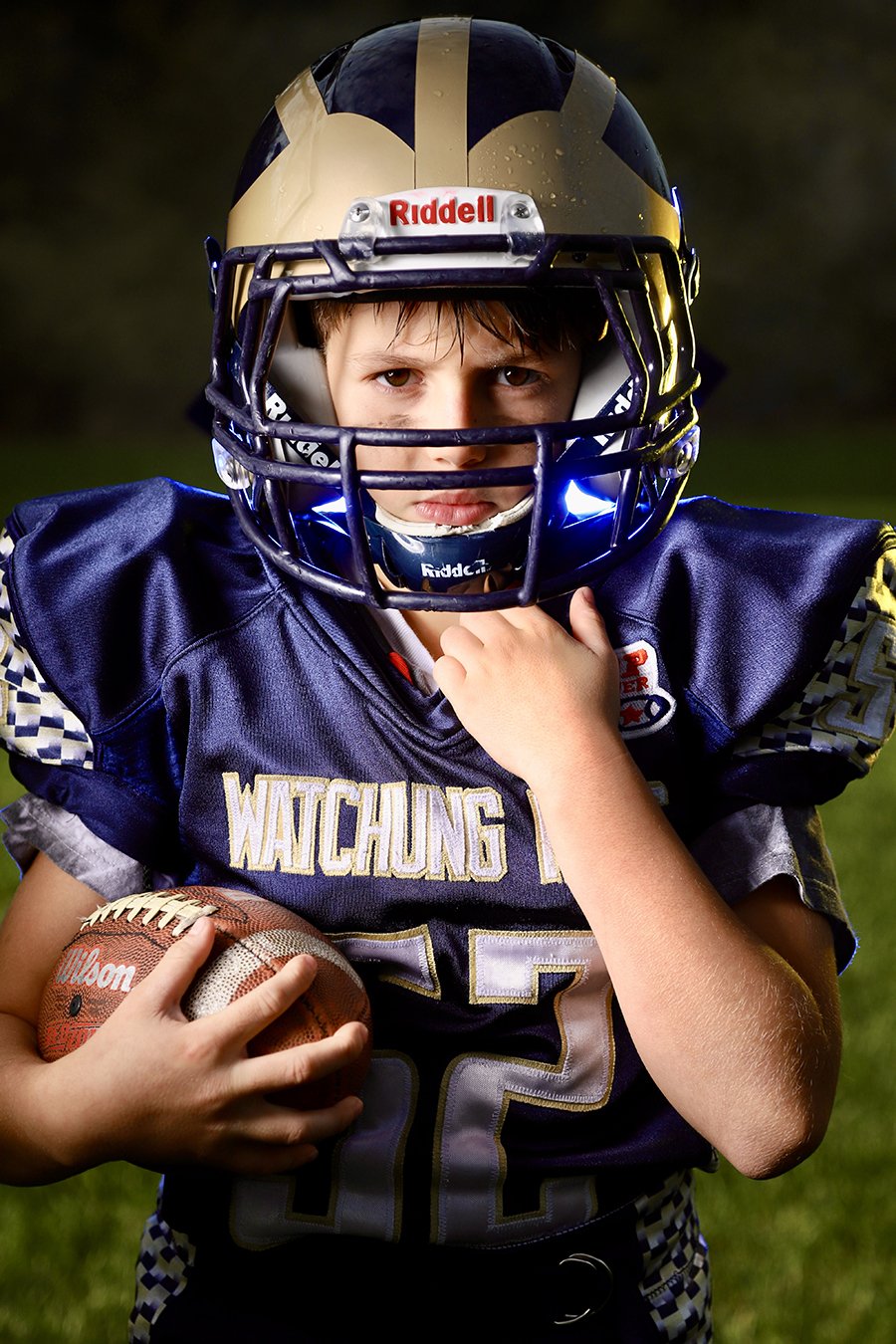 sports portrait second boy holding football.jpg