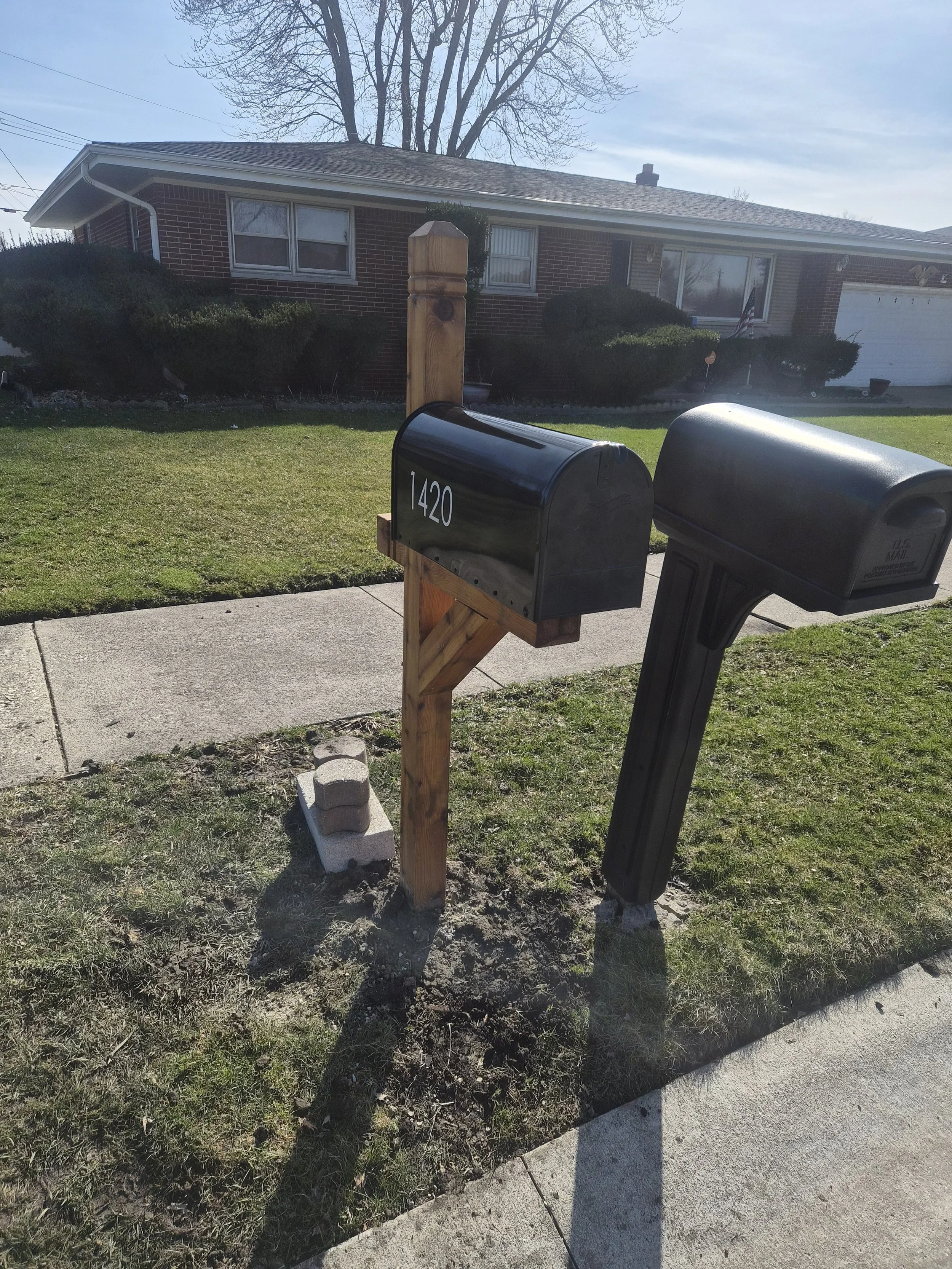 New cedar mailbox post and black mailbox with modern address numbers installed by Spartan Cityscape mailbox installation services in Northwest Indiana