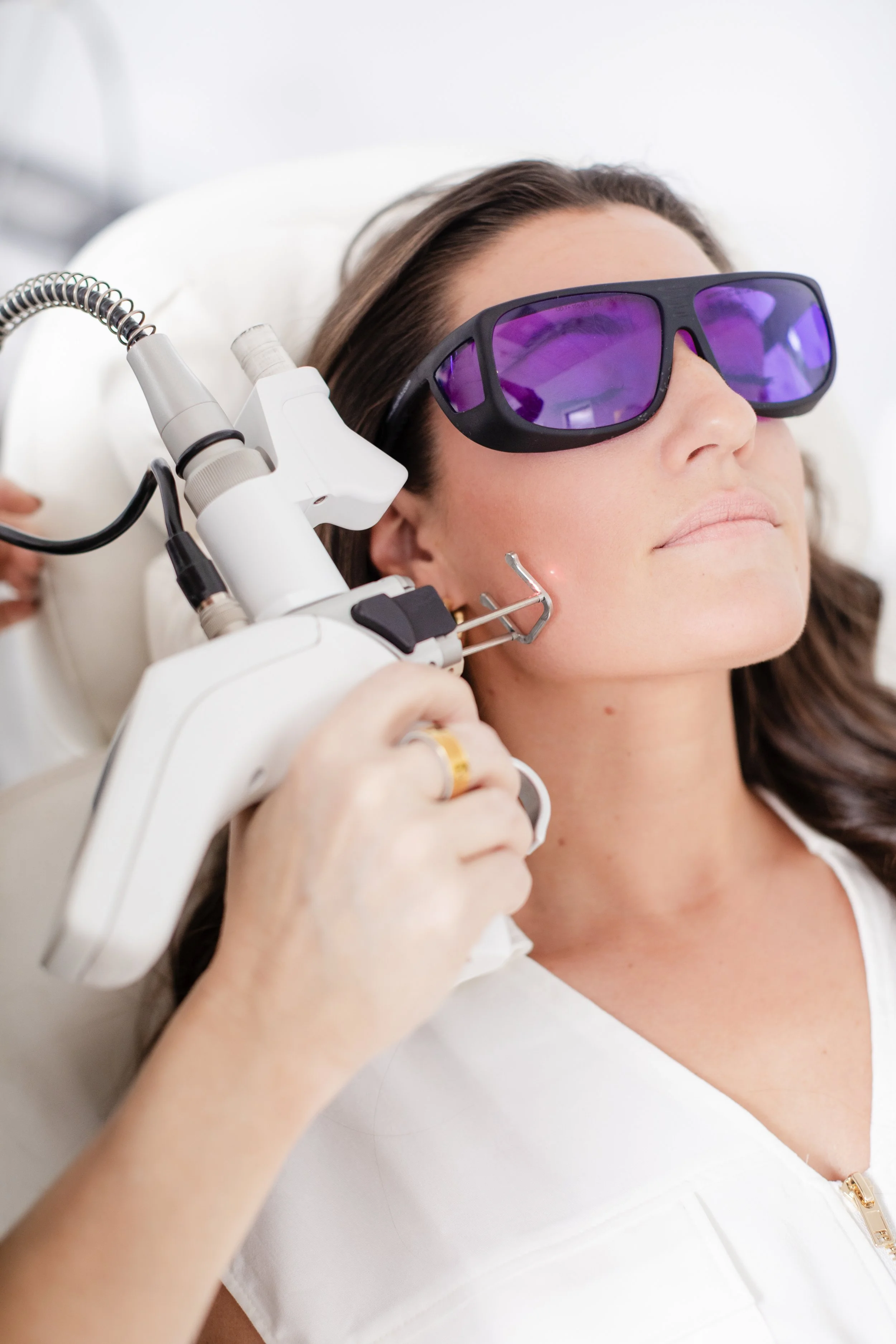 Woman receiving a cosmetic treatment.