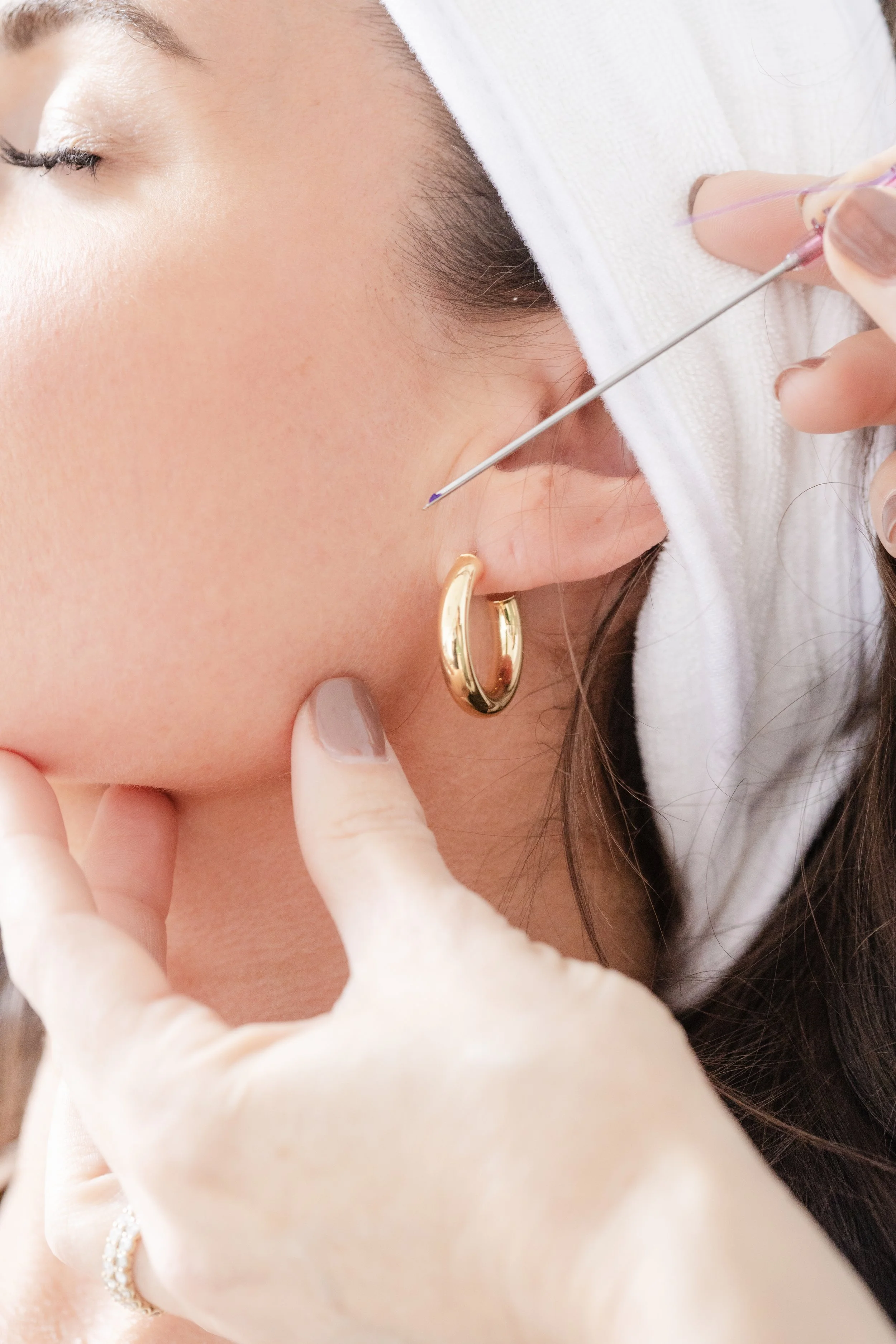 A client receiving a facial treatment
