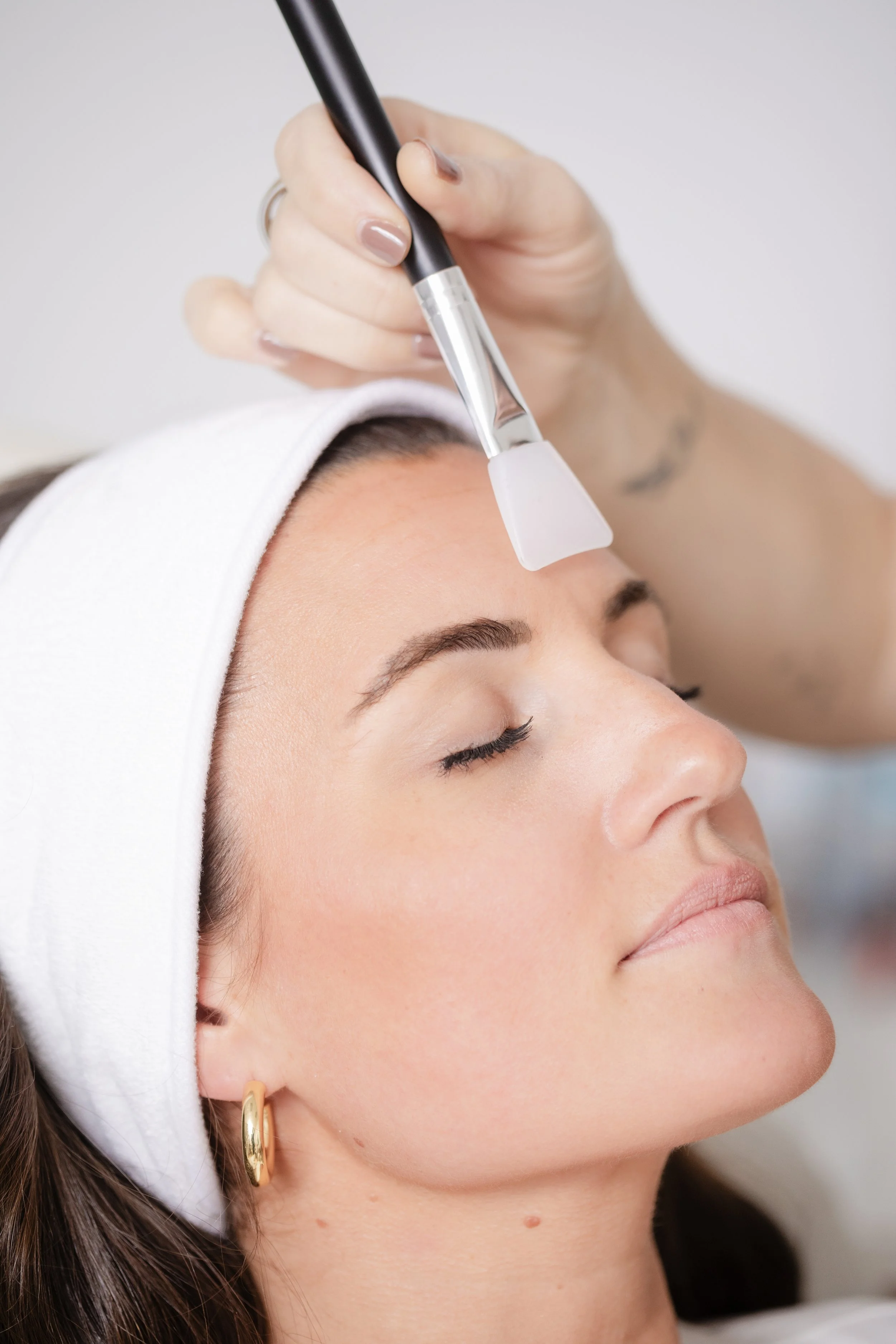 A client receiving a facial treatment