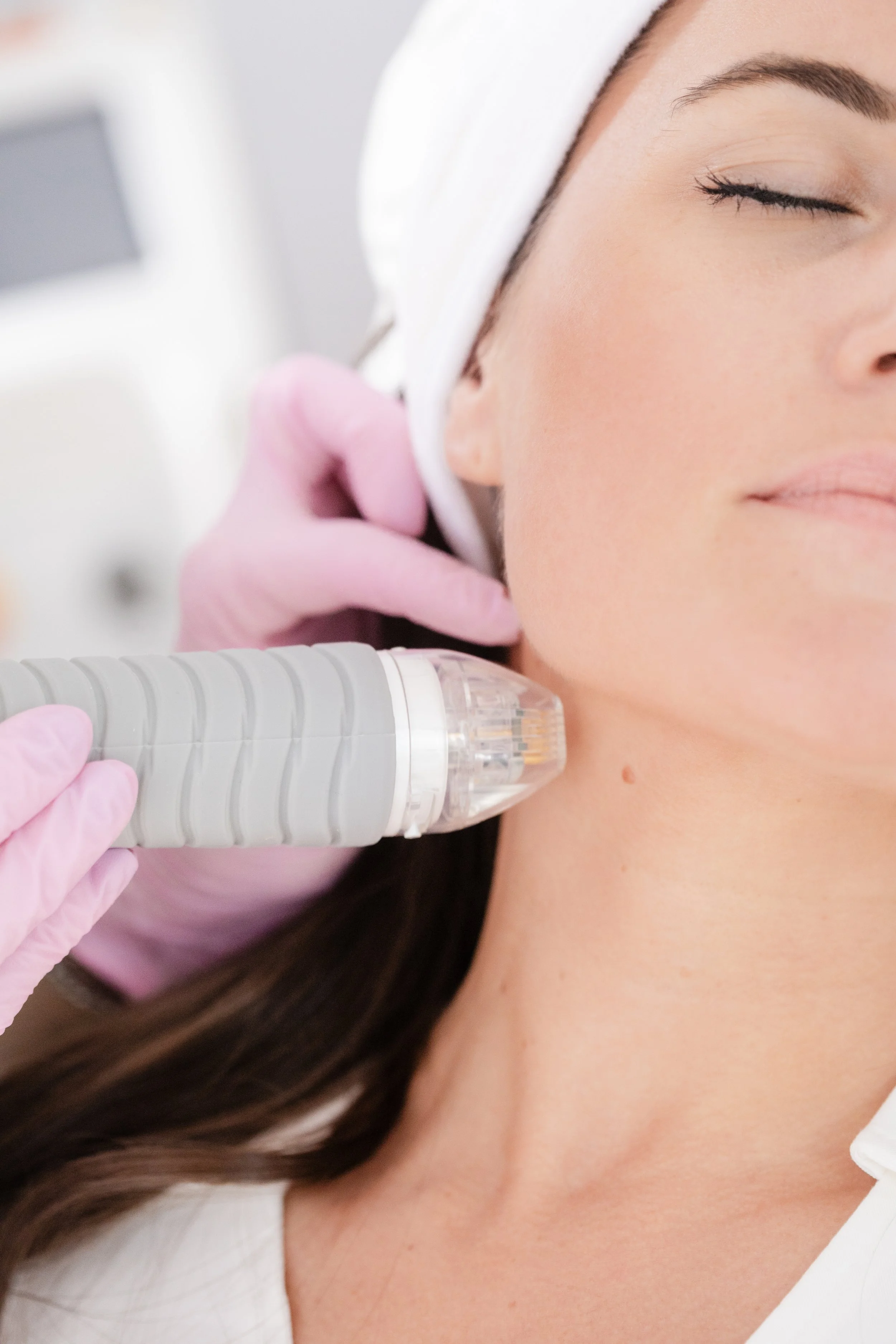 A woman receiving a facial treatment at Casey Powell PA