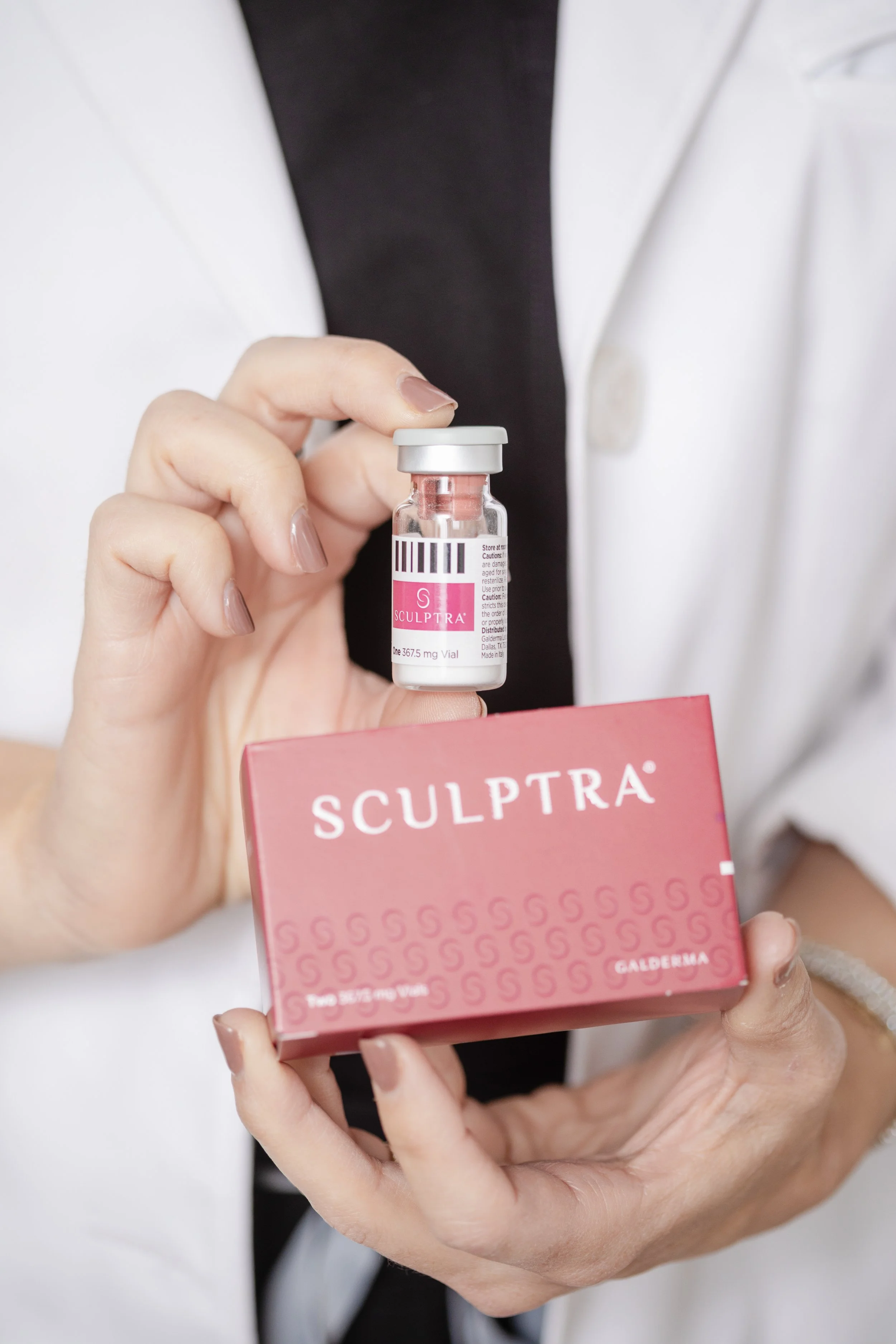 A person holding Sculptra