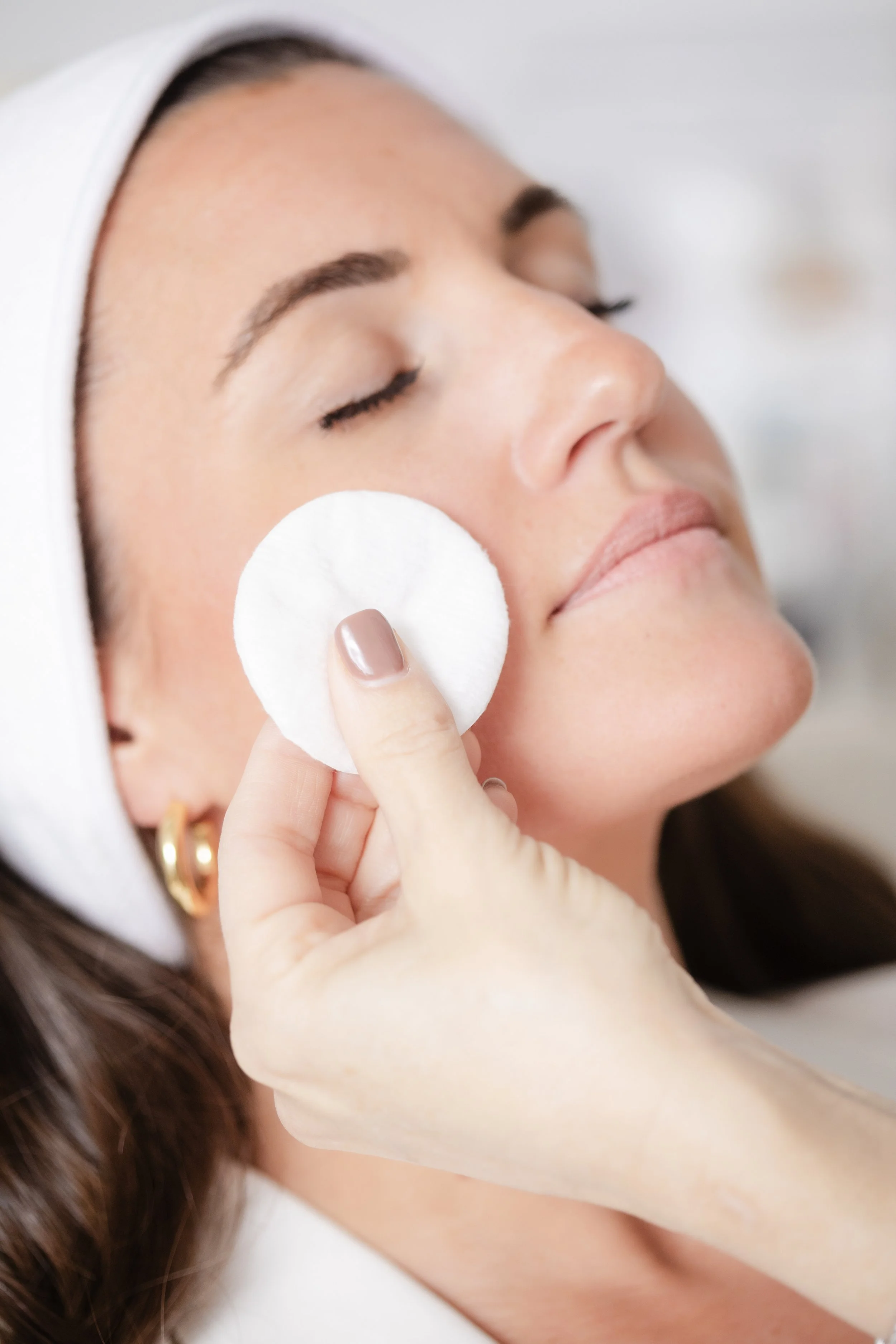 Client receiving a facial treatment at Casey Powell PA