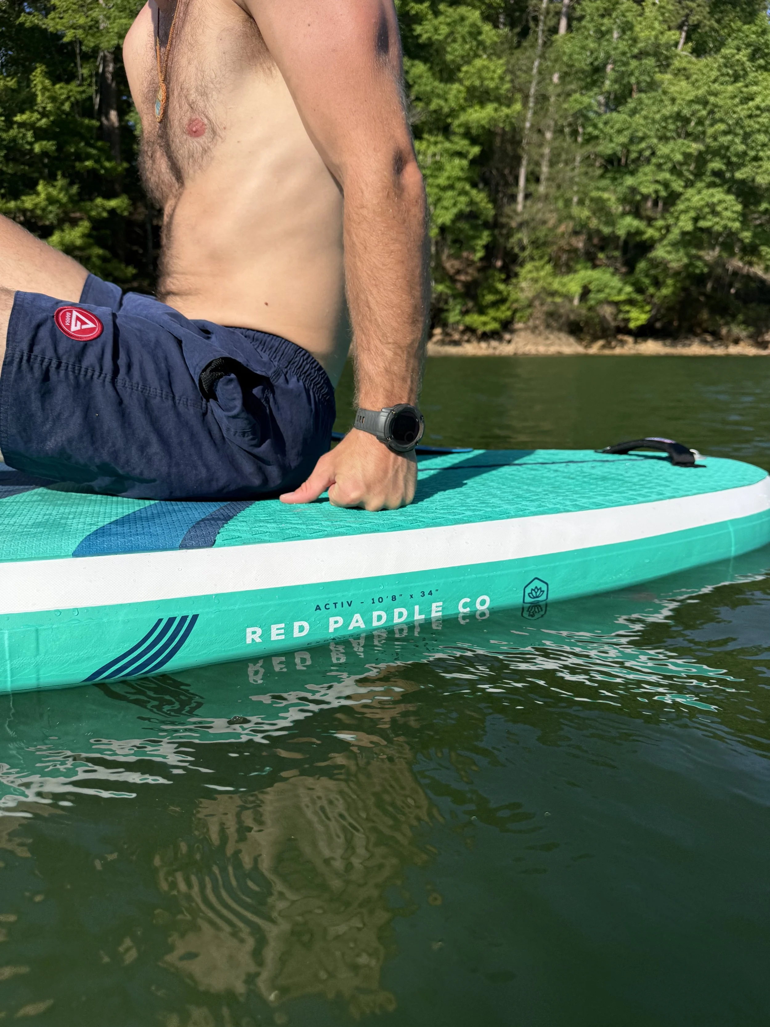 Close-up of inflatable SUP rental floating on calm North Carolina lake water