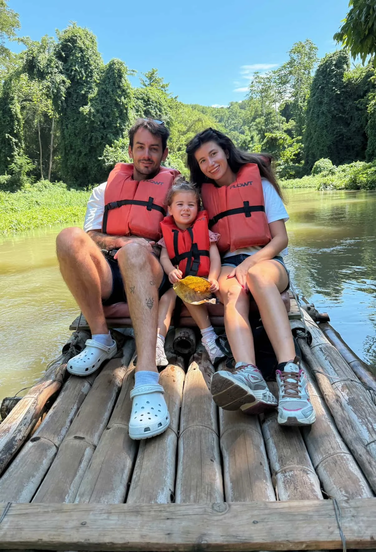 Family travel content creators enjoying a bamboo rafting experience in Falmouth, Jamaica