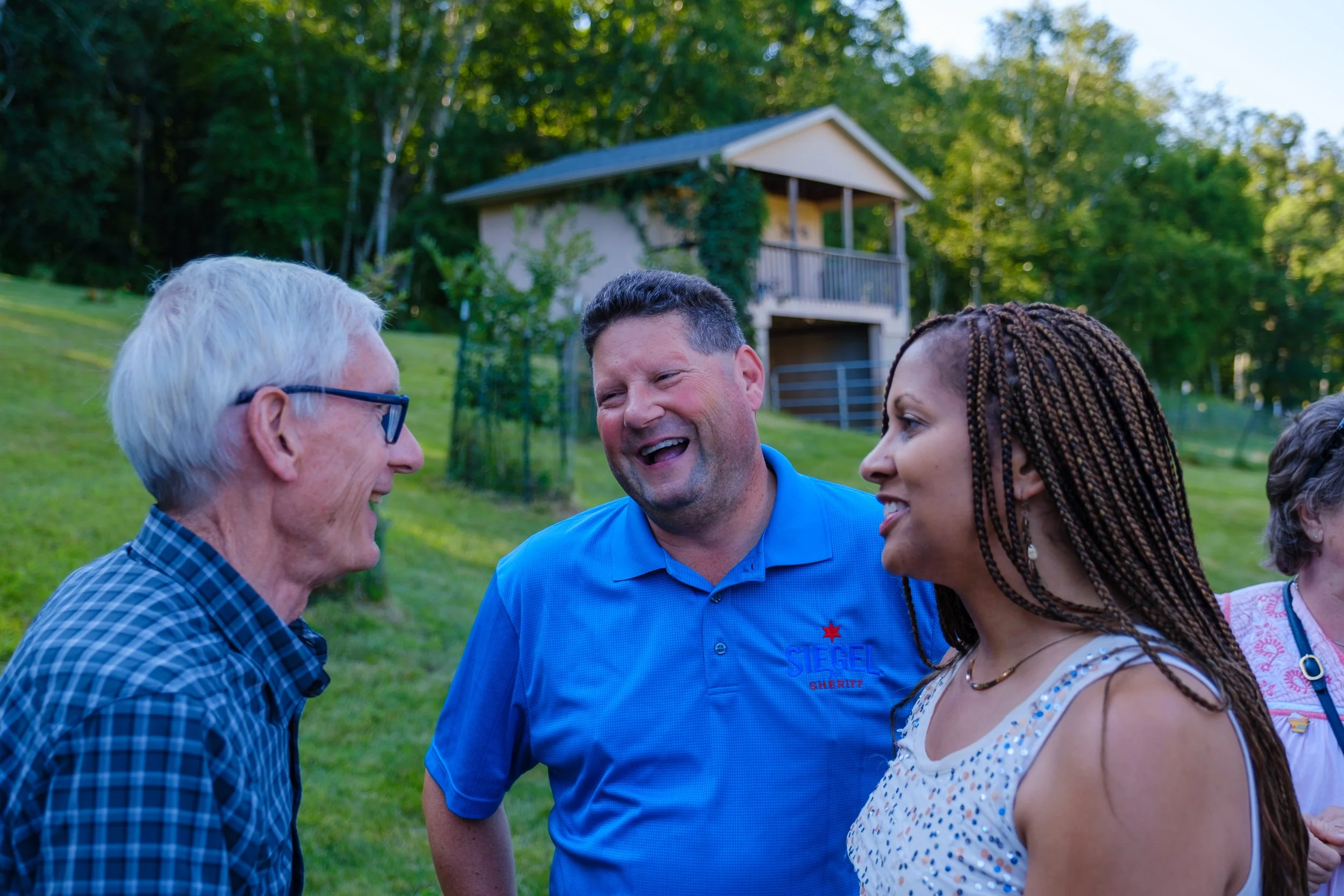 Governor Tony Evers laughing with La Crosse County Sheriff John Siegel.