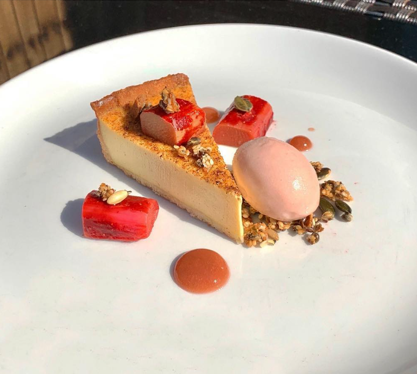 Baked Egg Custard Tart, Sous Vide Pimm’s Rhubarb, Seed Praline, Coulis & Rhubarb & Star Anise Ice Cream