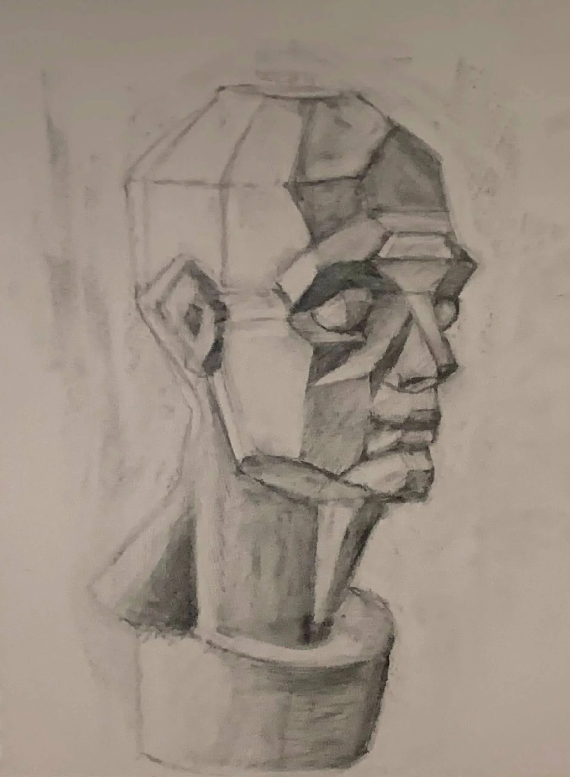 Pencil sketch of a sculpture of a man's head in profile, mounted on a stand