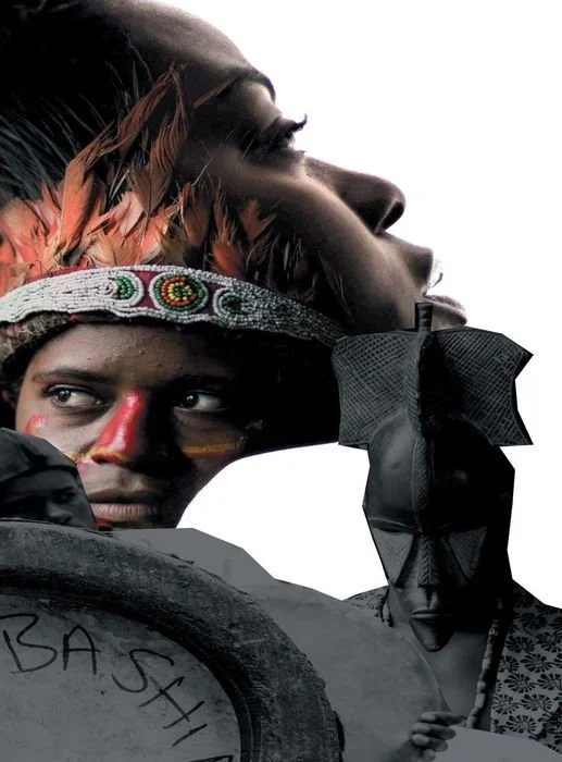 A person with traditional face paint and wearing a feathered headdress, looking into the distance, holding a black flag or banner.