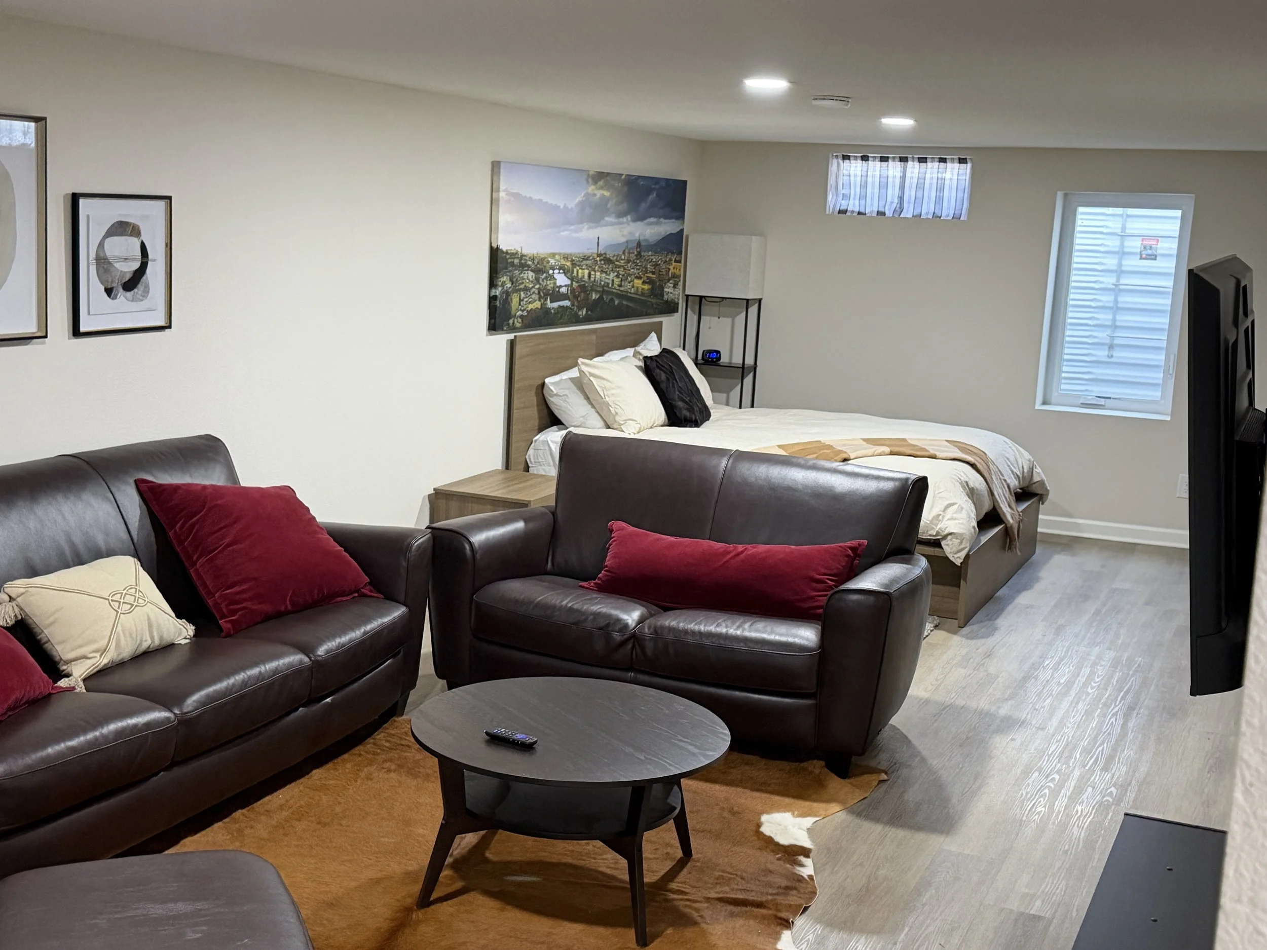 Open studio-style suite with 2 queen beds in the finished basement. Bathroom close by!