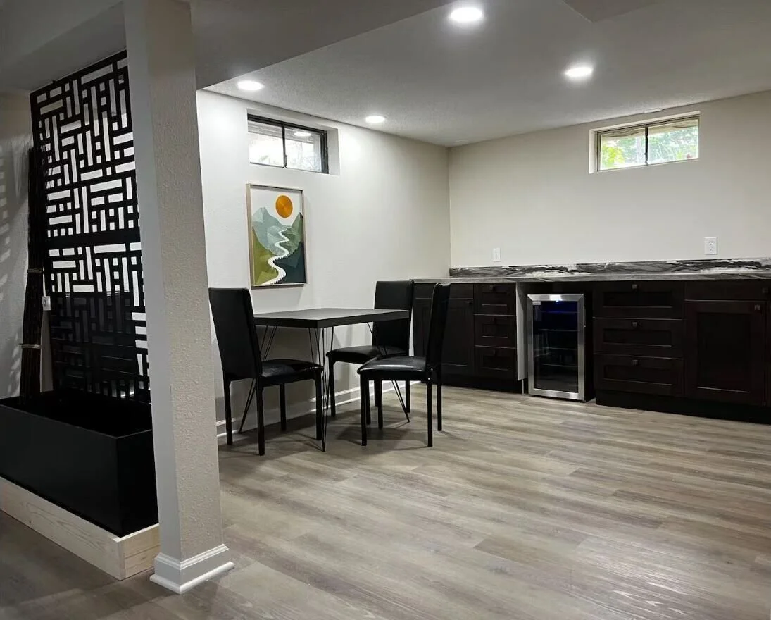 Basement rec area with beverage fridge.  Lots of extra storage cabinets.
