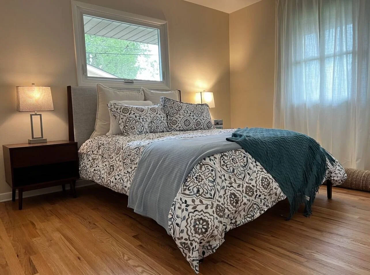 2nd queen bedroom with private 1/2 bath and closet. Quiet space for restful sleep.