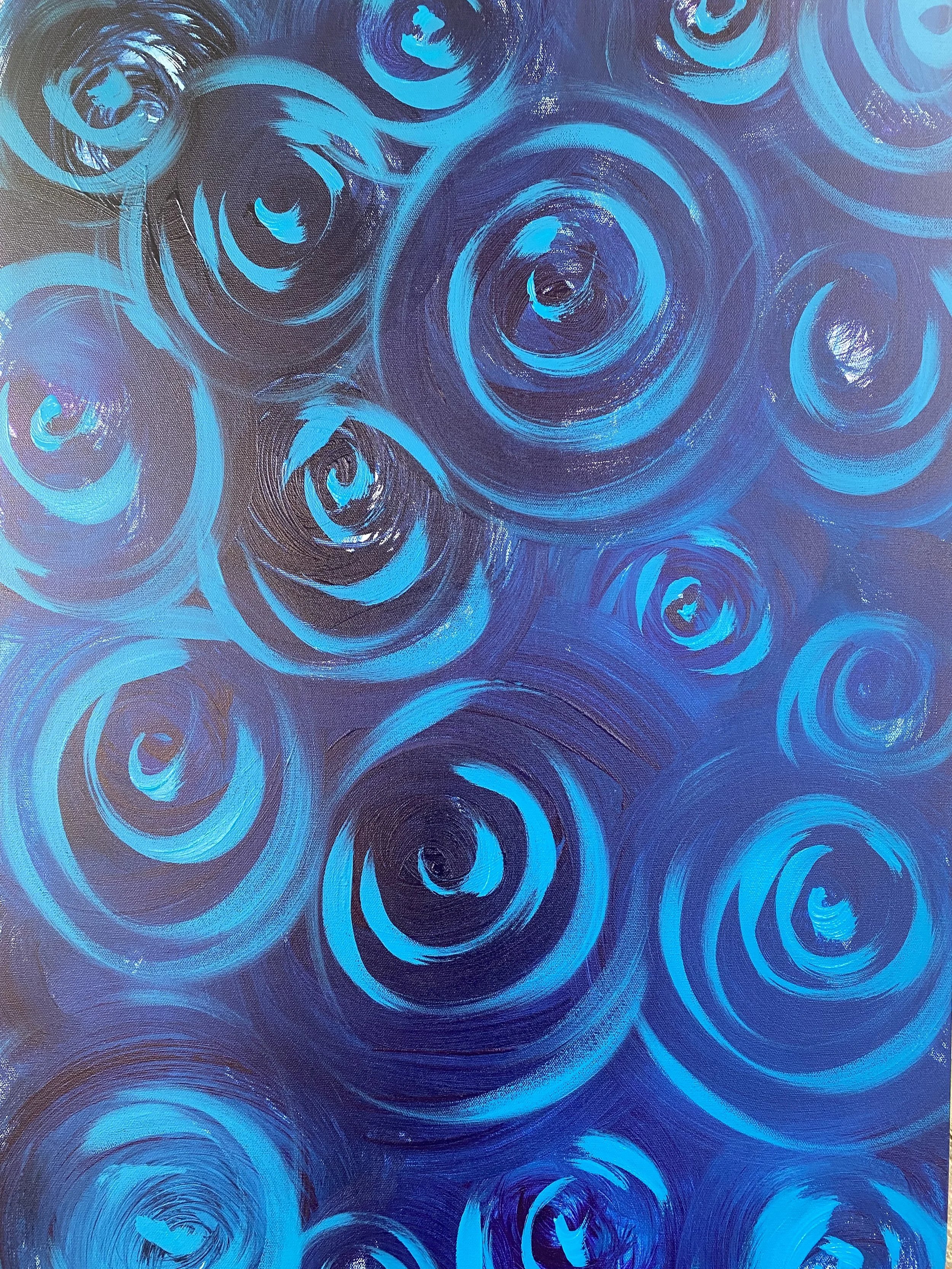 "All Still Spinning" 

You are not the only one.
That is what this painting says. Not quietly — boldly, in electric cyan and midnight blue, across every inch of the canvas. Dozens of spirals bloom like roses in the dark, each one turning inward towar