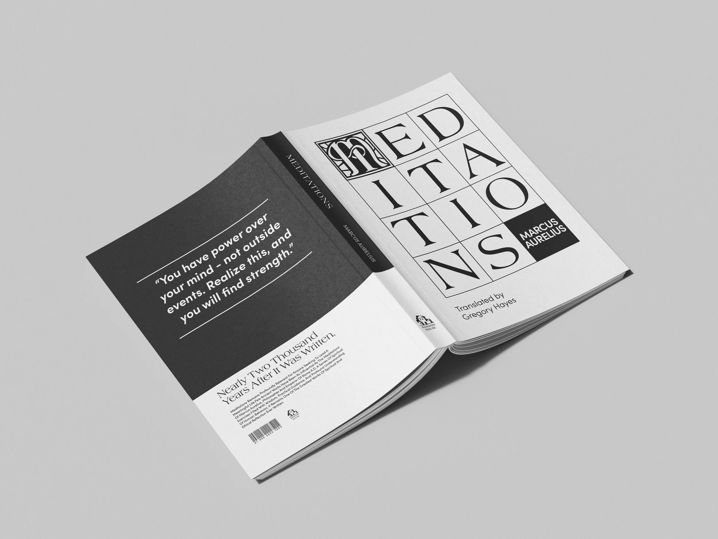 Open book titled 'Meditations' by Marcus Aurelius, translated by Gregory Hayes, lying on a white surface.